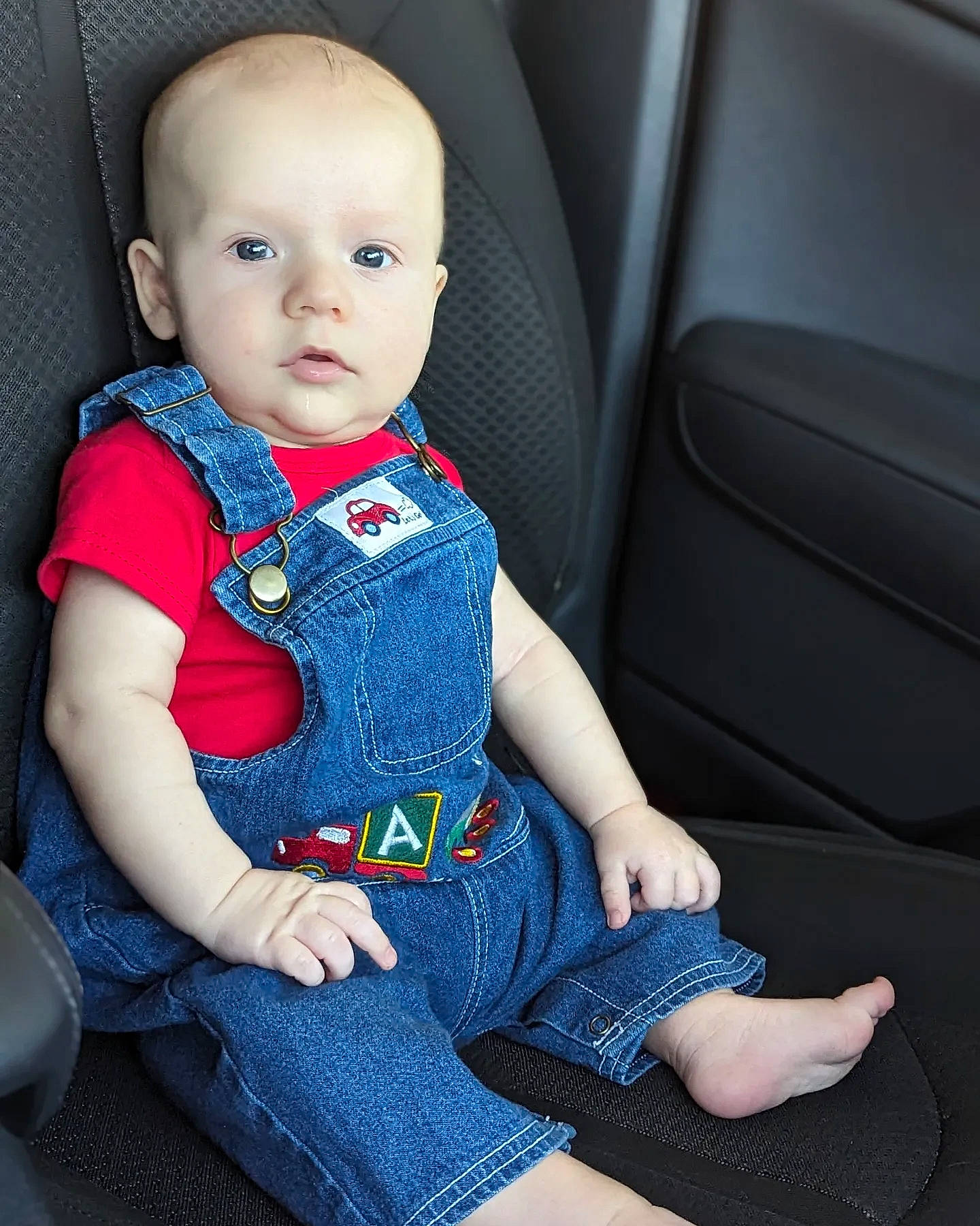 David joined the competition — help win amazing prizes! auto_part, baby, baby_toddler_clothing, car_seat, car_seat_cover, cheek, child, collar, comfort, dress, electric_blue, head_restraint, human_leg, neck, pattern, person, seat_belt, sitting, sleeve, toddler
