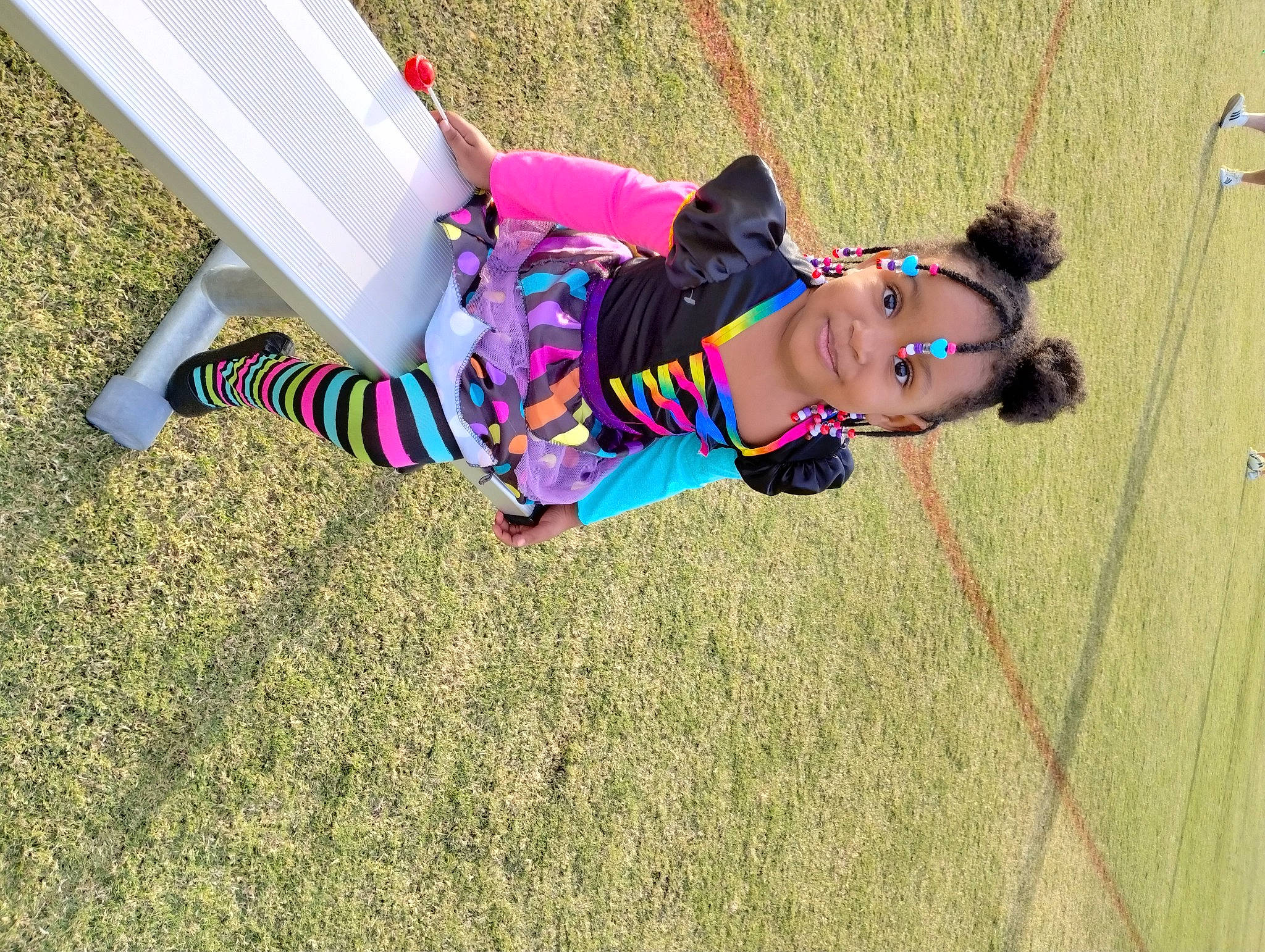 Sommer Riley is registered to the contest to win money with this photo: adventure, child, competition, competition_event, fun, grass, happy, hula_hoop, human_leg, joy, knee, landscape, leisure, person, play, public_event, recreation, rope, sports, swing