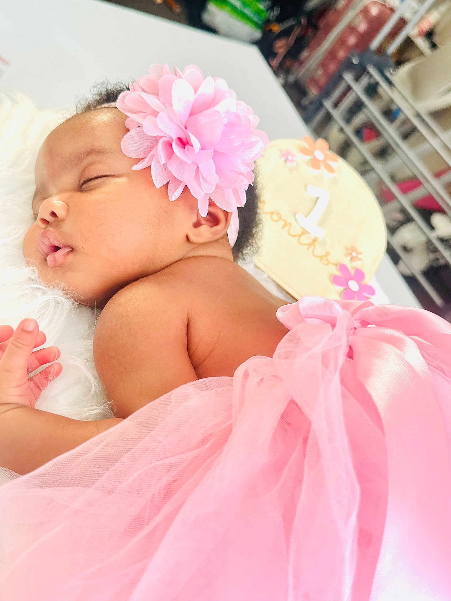 Mirella joined the competition — help win amazing prizes! baby, infant, sleeping, pink, flower_headband, tutu, soft, white_surface, milestone_sign, 1_month, cute, peaceful, portrait, child, newborn, closeup, adorable, resting, skin, hand