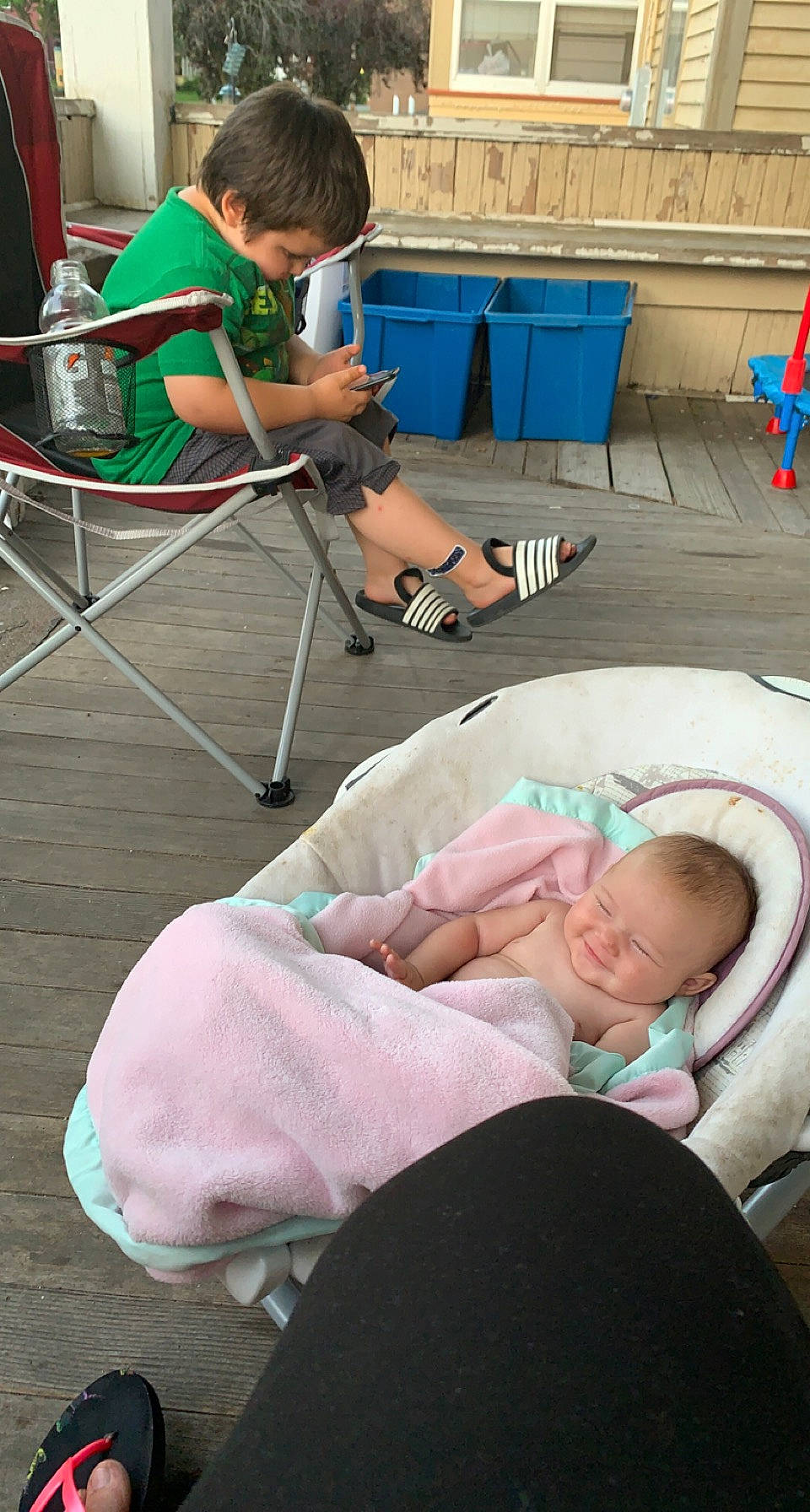 Faith is registered to the contest to win money with this photo: baby, child, comfort, event, green, hair, hand, human_body, joint, knee, leg, leisure, person, room, service, shorts, sitting, skin, snapshot, table