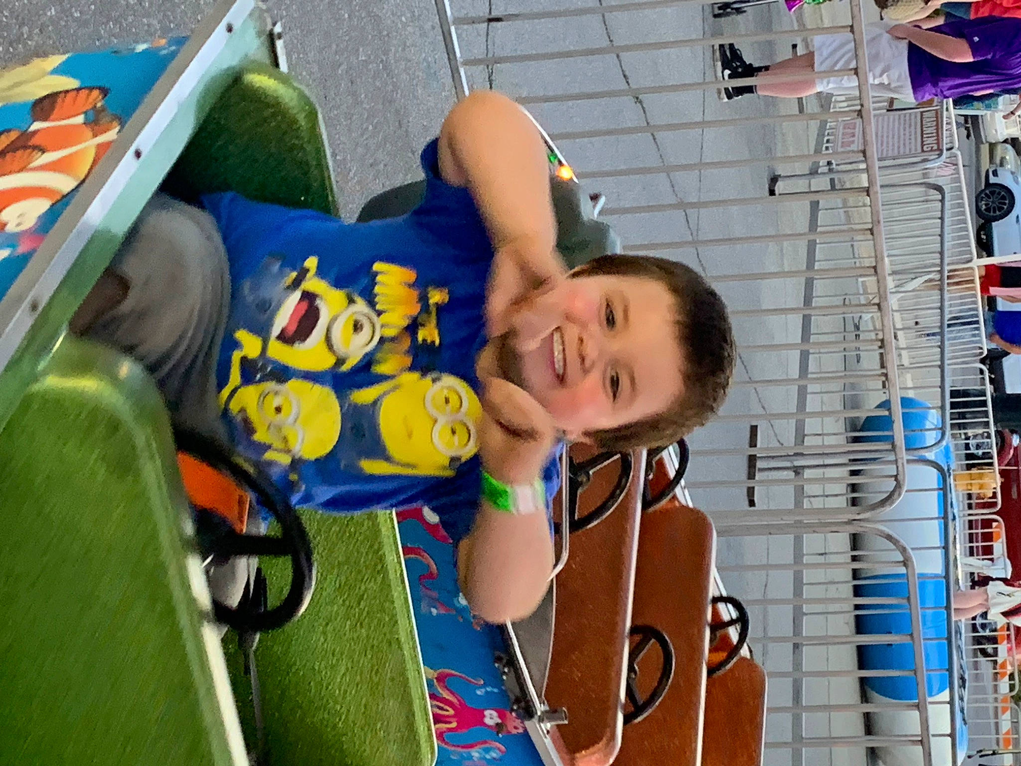 Mark Jr is registered to the contest to win money with this photo: chair, child, fun, happy, joy, leisure, motor_vehicle, person, play, product, recreation, room, sitting, smile, summer, t_shirt, toddler, vacation, vehicle_door, youth