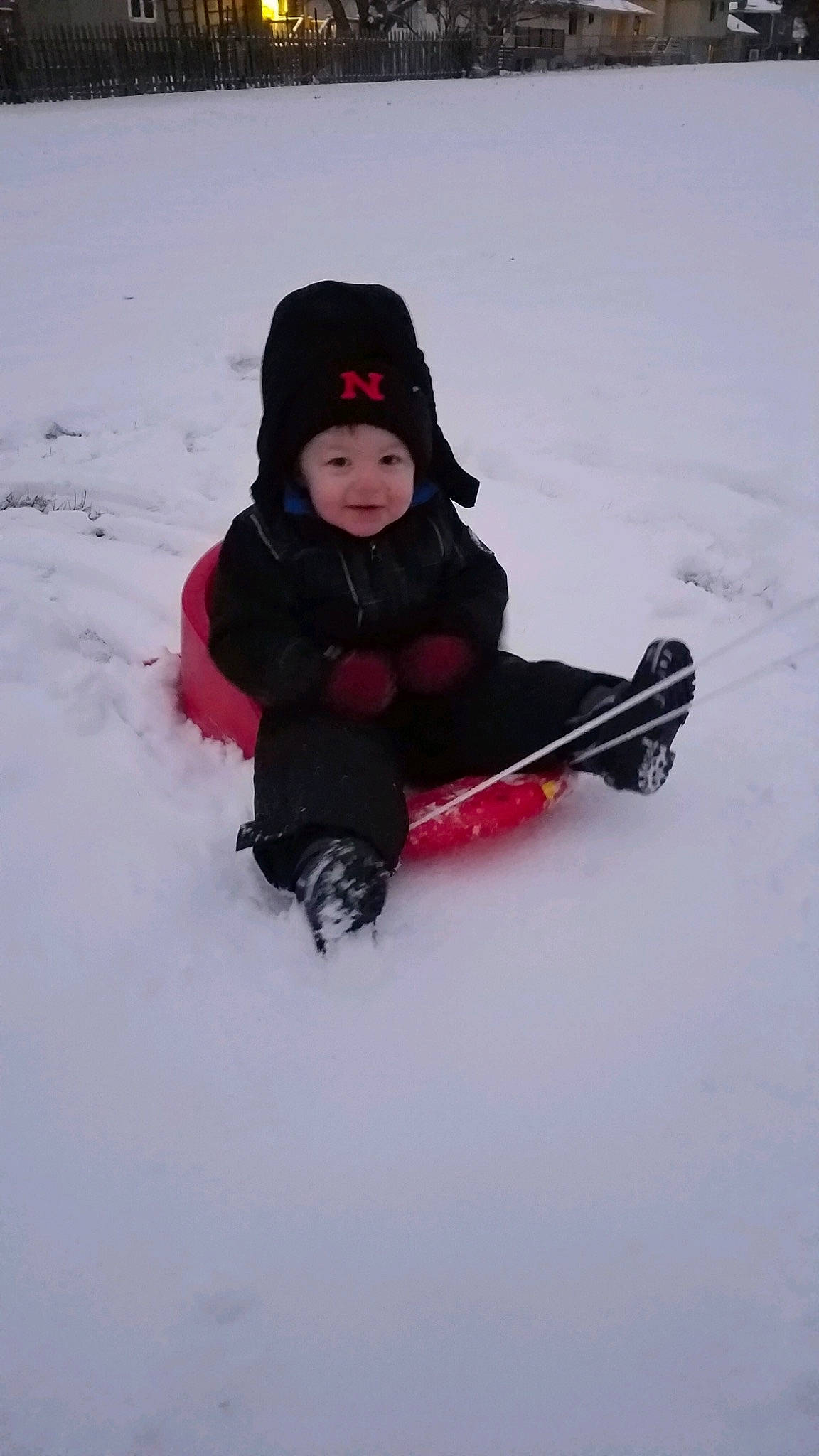 Koltyn joined the competition — help win amazing prizes! child, freezing, fun, person, playing_in_the_snow, recreation, sitting, sled, sledding, snow, toddler, vehicle, winter, winter_sport