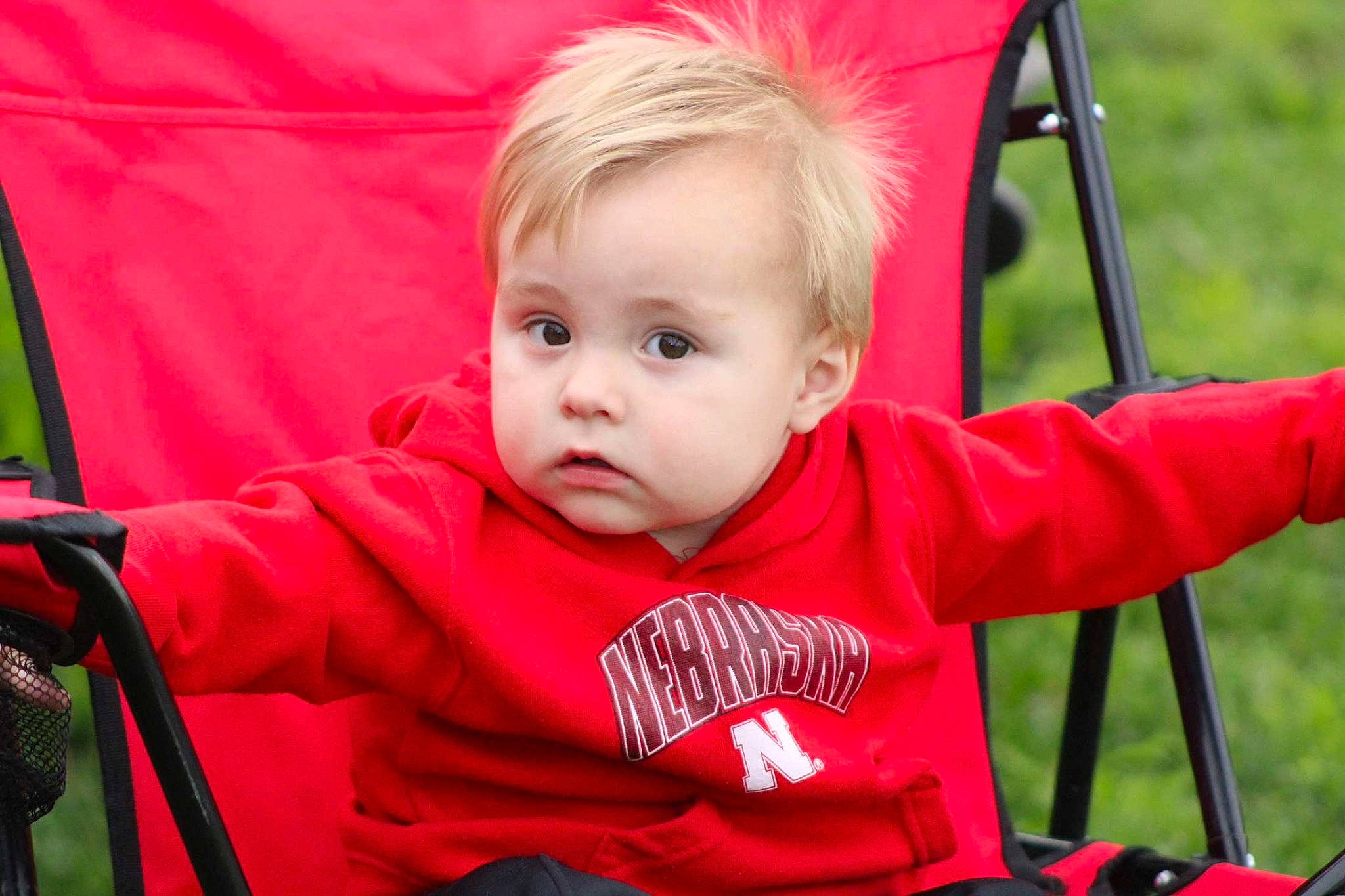 Paxton is registered to the contest to win money with this photo: baby, baby_carriage, baby_products, baby_toddler_clothing, chair, cheek, child, comfort, eye, fun, grass, happy, iris, leisure, person, plant, recreation, sitting, skin, toddler