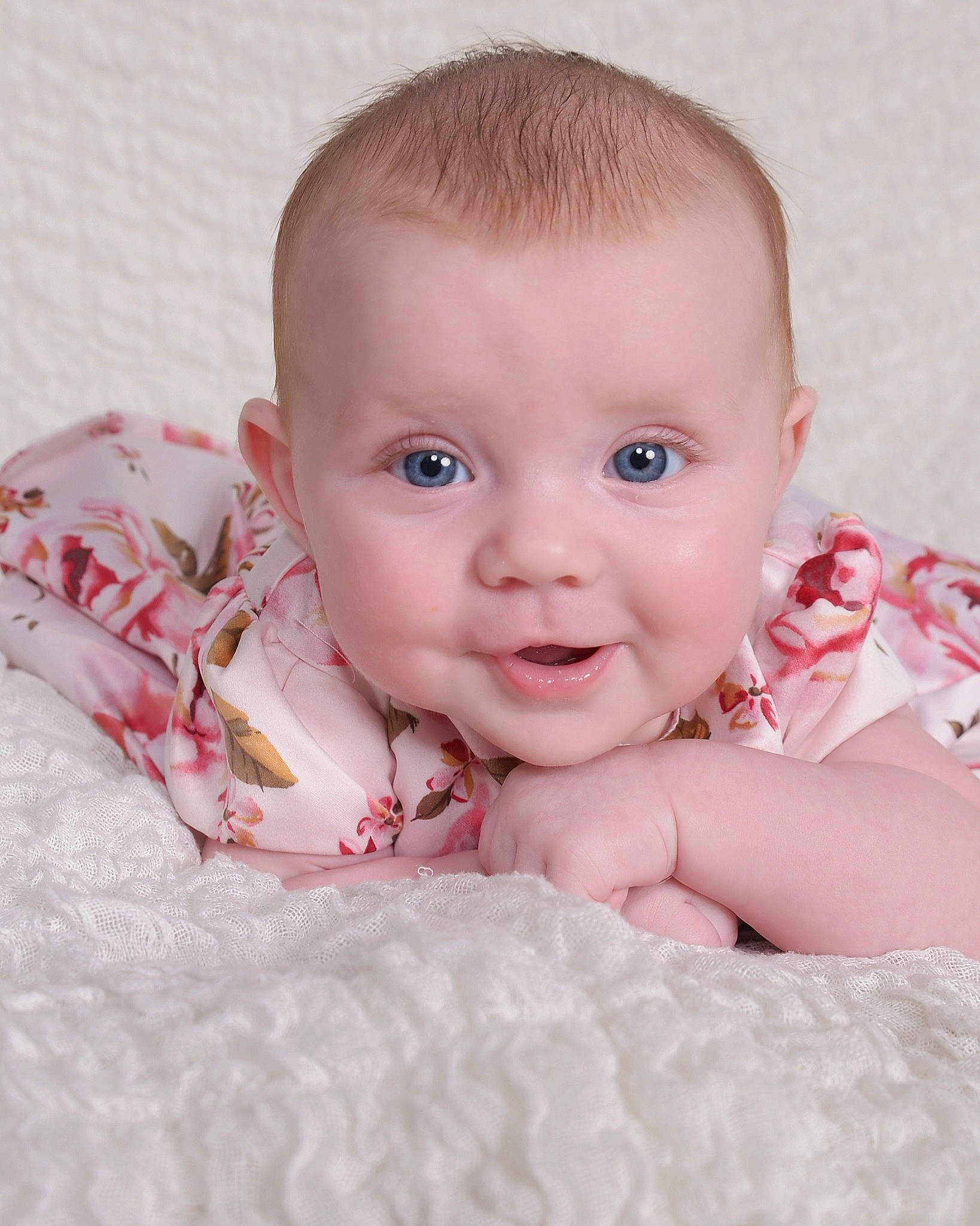 Peyton is registered to the contest to win money with this photo: arm, baby, baby_toddler_clothing, cheek, chin, comfort, eye, eyebrow, facial_expression, flash_photography, happy, iris, linens, lip, nose, person, skin, sleeve, smile, toddler