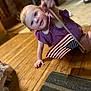 Macie is registered to the contest to win money with this photo: toddler, child, flag, american_flag, purple_dress, crawling, wooden_floor, indoor, carpet, hand, face, person, patriotic, home, cute, young_child, infant, expression, celebration, small_flag