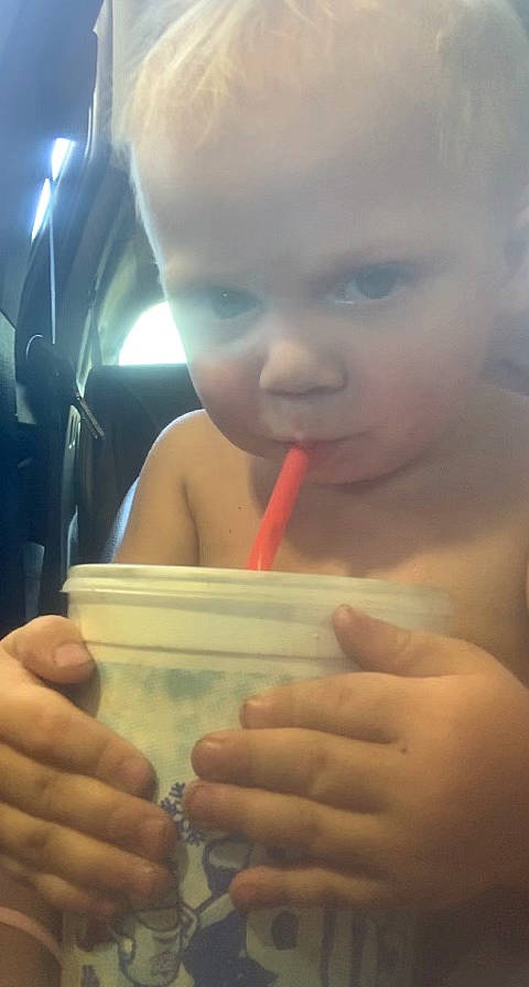 Kolton is registered to the contest to win money with this photo: baby, biting, cheek, chest, drinking, drinkware, eyelash, finger, fun, gesture, hand, happy, lip, mouth, nail, nose, person, skin, smile, thumb