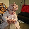 Skyla joined the competition — help win amazing prizes! baby, blanket, child, clothing, couch, door, dress, expression, fabric, face, floor, hand, hat, home, indoor, light, person, pink, plaid, sparkle