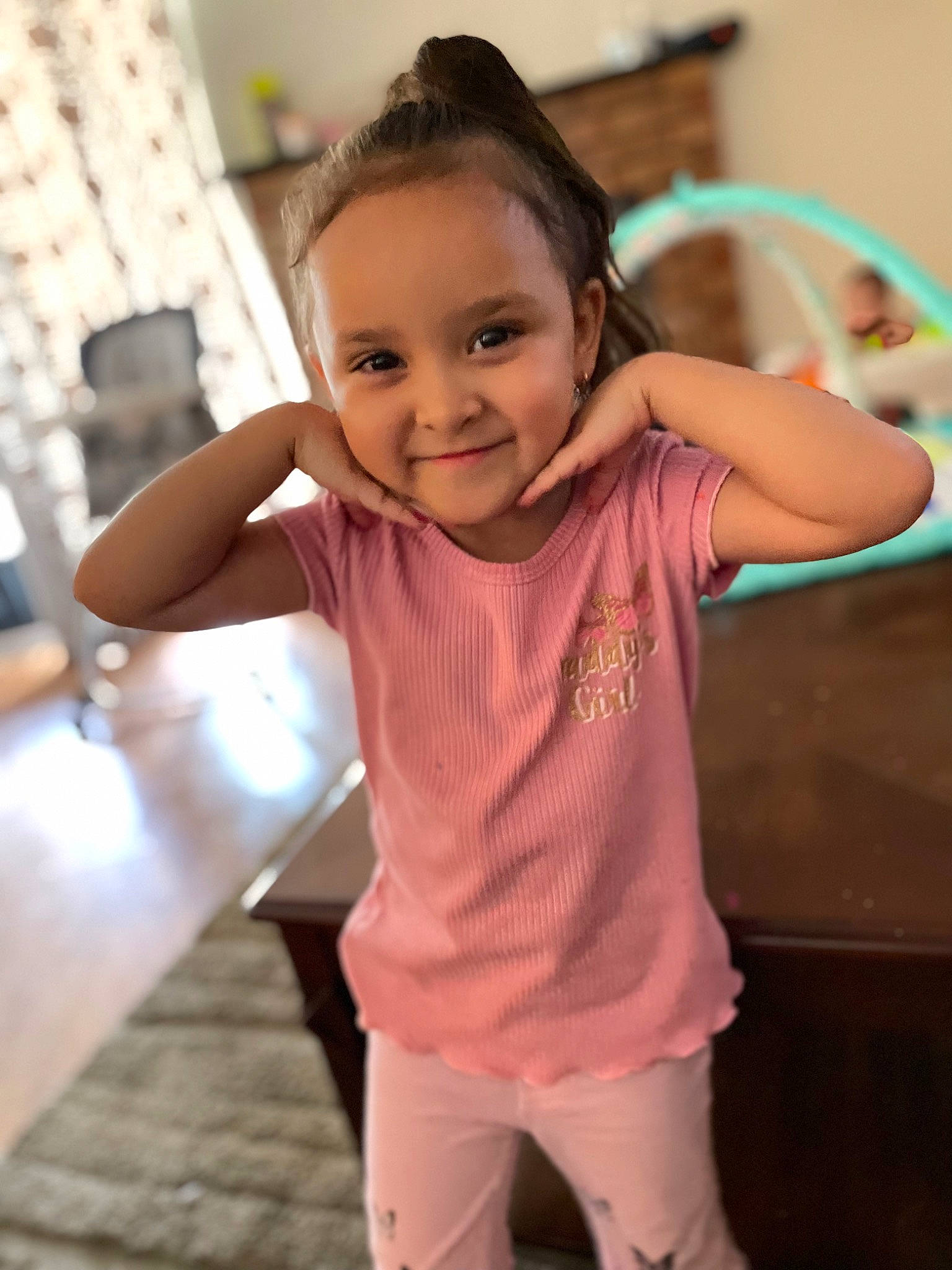 Meilani is registered to the contest to win money with this photo: baby_toddler_clothing, cheek, child, chin, event, fun, gesture, happy, joy, leisure, magenta, neck, person, room, shoulder, skin, sleeve, smile, t_shirt, thumb