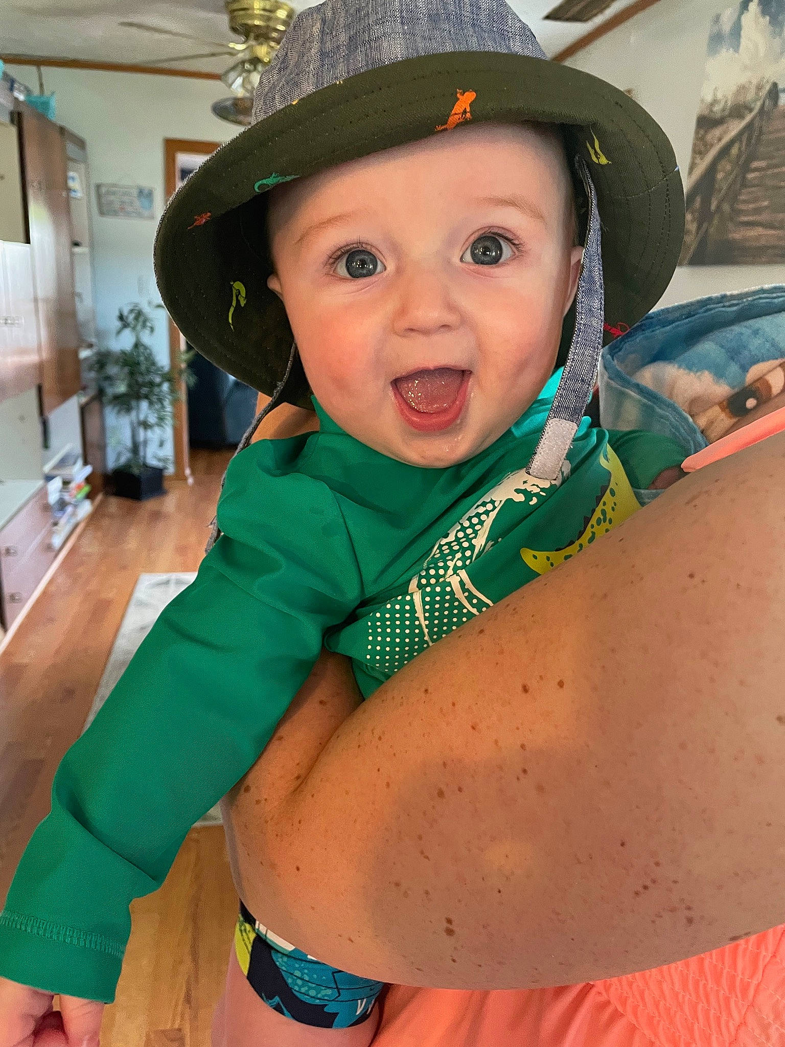 Conrad is registered to the contest to win money with this photo: abdomen, blue, cap, chest, child, cool, costume_hat, elbow, fun, happy, hat, headwear, houseplant, leisure, navel, person, sleeve, sun_hat, surprise, thigh