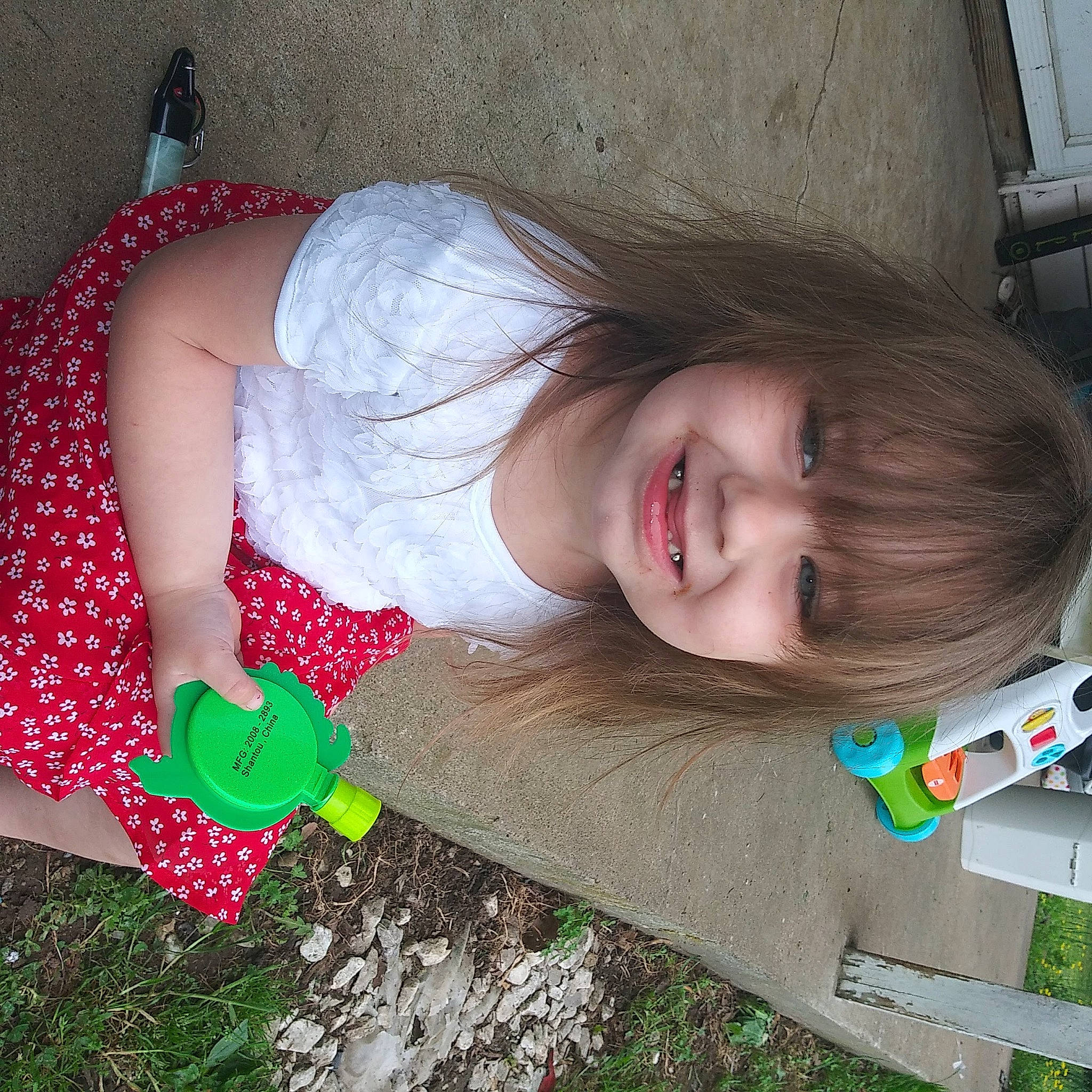 Jolene is registered to the contest to win money with this photo: dress, facial_expression, finger, fun, grass, green, hair, hairstyle, happy, head, human_body, iris, joy, lip, mouth, nose, person, pink, plant, product