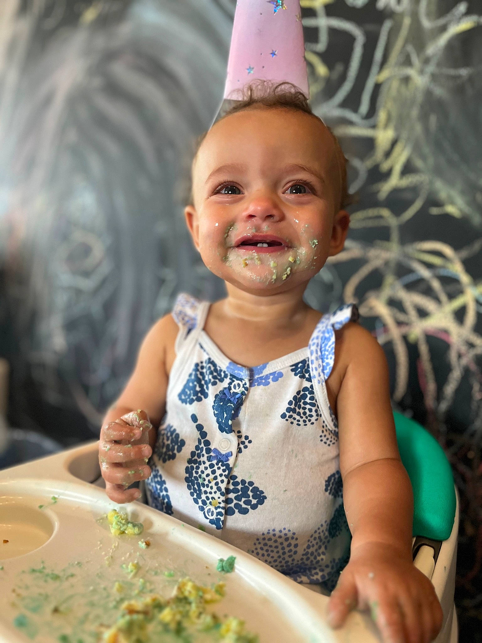 Cora joined the competition — help win amazing prizes! adaptation, baby, baby_toddler_clothing, birthday, cap, chair, child, costume_hat, event, facial_expression, finger, fun, happy, leisure, party_hat, person, skin, smile, summer, table