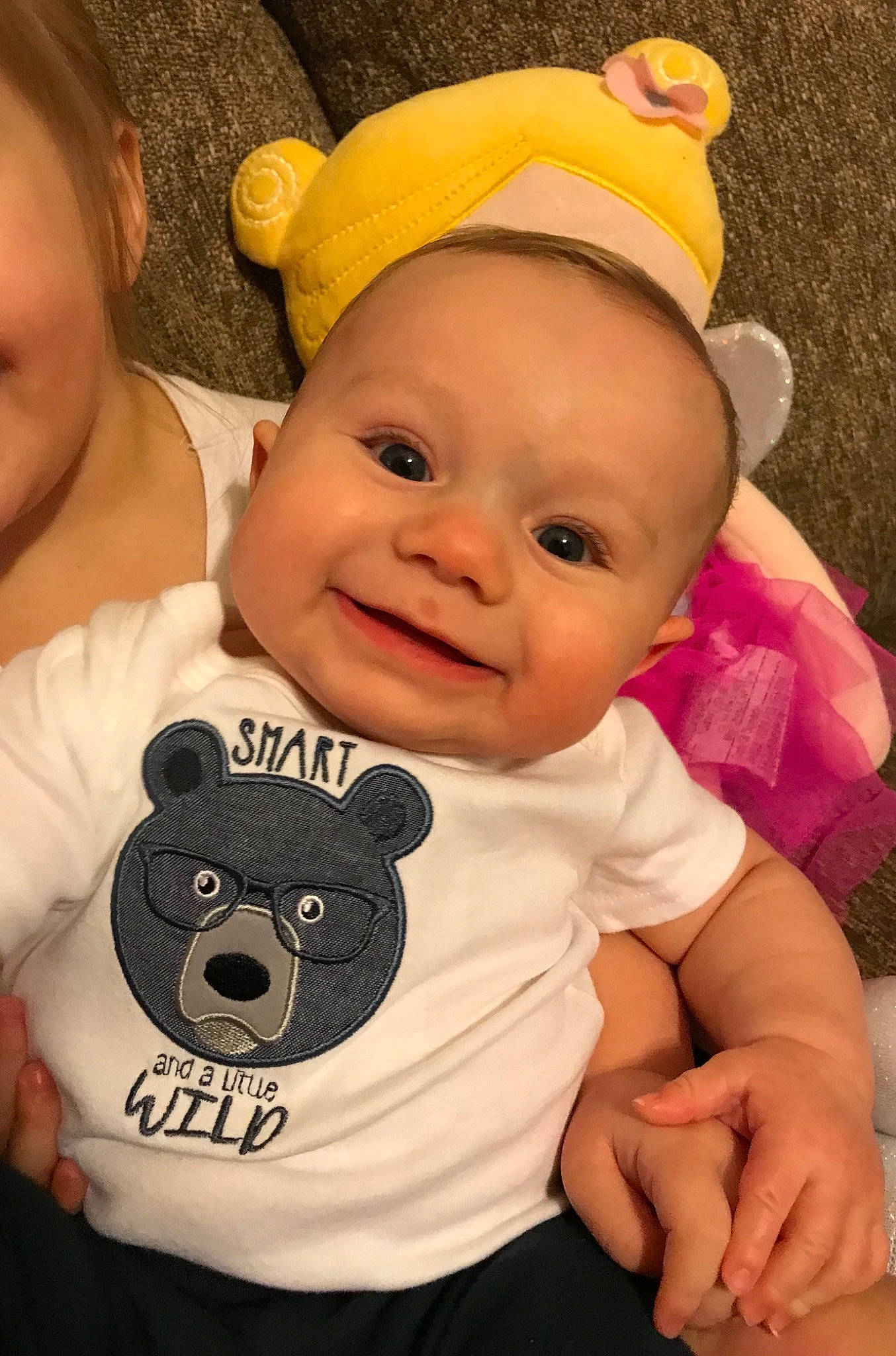 Harrison is registered to the contest to win money with this photo: baby, baby_toddler_clothing, cheek, face, facial_expression, finger, happy, headgear, iris, joy, mammal, organ, person, pink, product, skin, sleeve, smile, textile, toddler