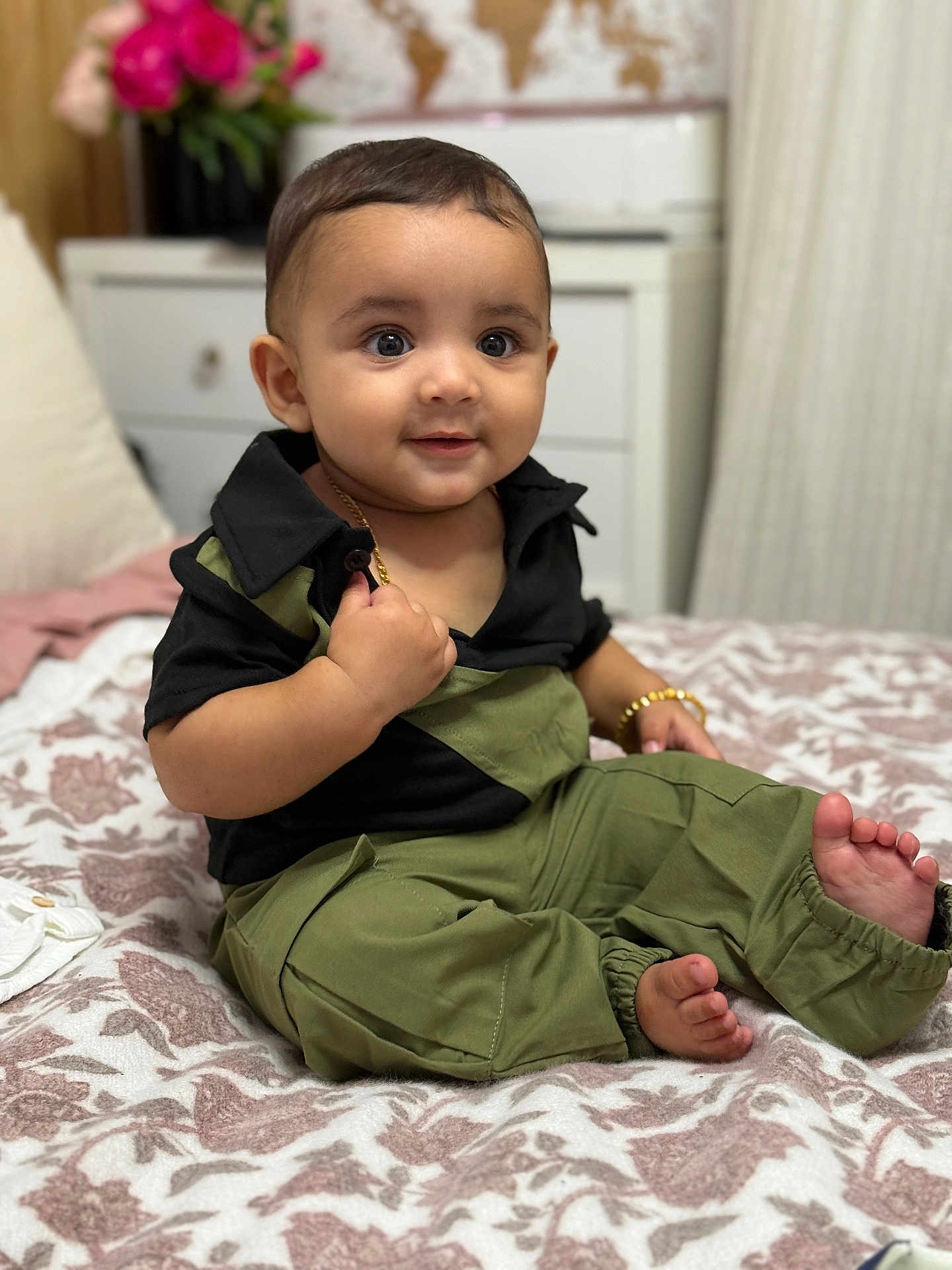 Shehzad joined the competition — help win amazing prizes! baby, child, infant, smiling, sitting, bed, blanket, clothing, bracelet, gold_chain, face, happy, indoors, furniture, pillow, flowers, curtains, map, portrait, cute