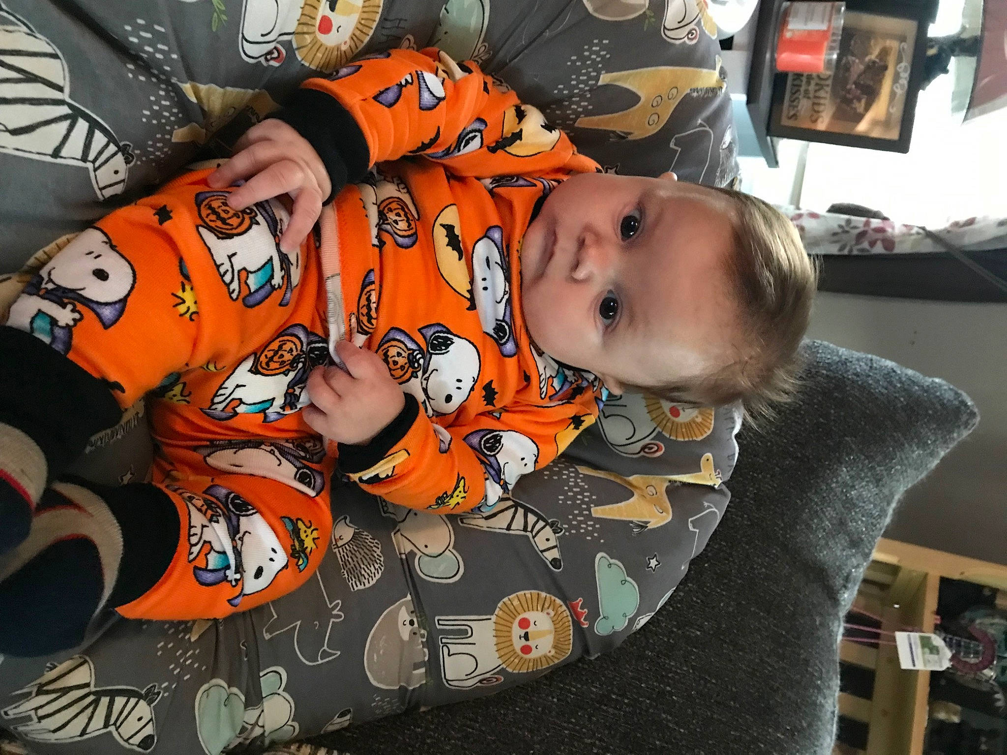 Declan is registered to the contest to win money with this photo: baby, baby_products, baby_toddler_clothing, cheek, child, comfort, fun, pattern, person, picture_frame, room, sitting, sleeve, t_shirt, toddler