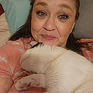 Kramer joined the competition — help win amazing prizes! woman, cat, indoor, bed, cuddling, smiling, closeup, face, pet, feline, fur, comfort, relaxation, casual, human, animal, friendship, rest, pillow, clothing