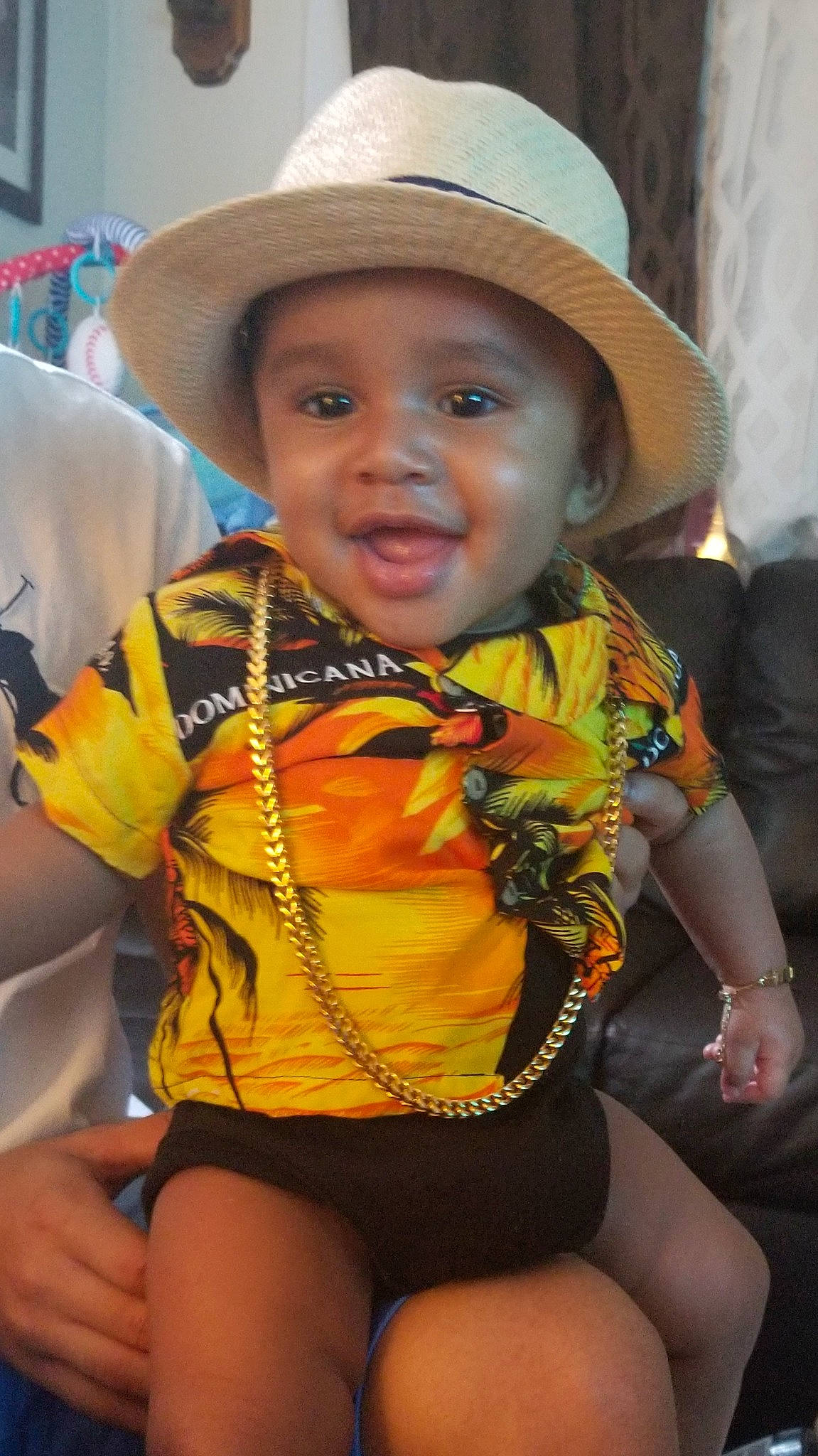 Tristan is registered to the contest to win money with this photo: abdomen, child, fashion_accessory, hat, headgear, headwear, leg, person, smile, sun_hat, thigh, toddler, trunk