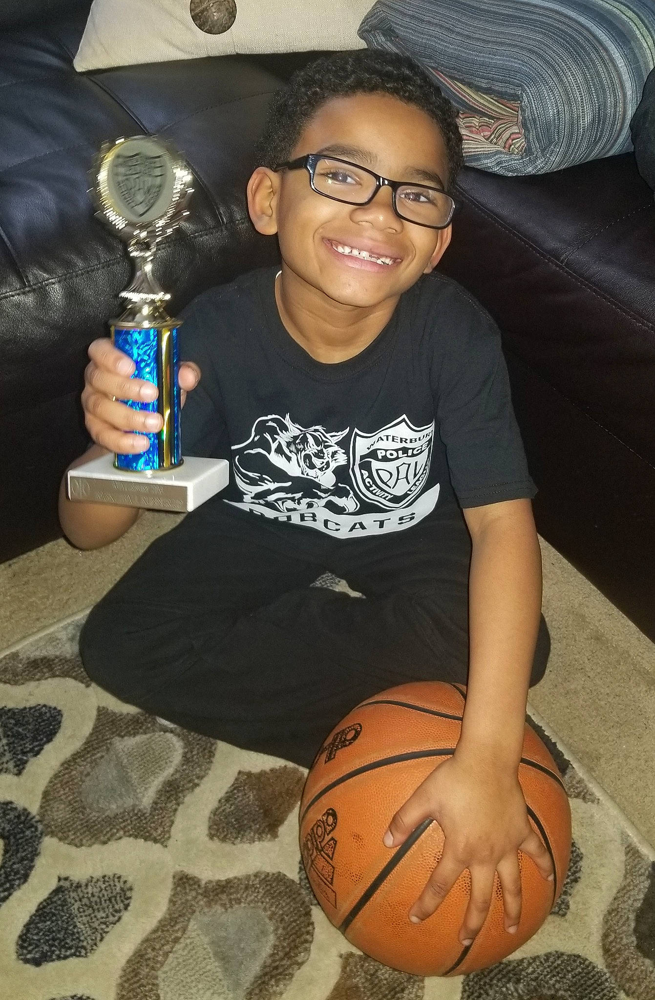 Jerome is registered to the contest to win money with this photo: arm, child, cool, eyewear, fun, glasses, joy, person, sitting, smile, t_shirt, vacation