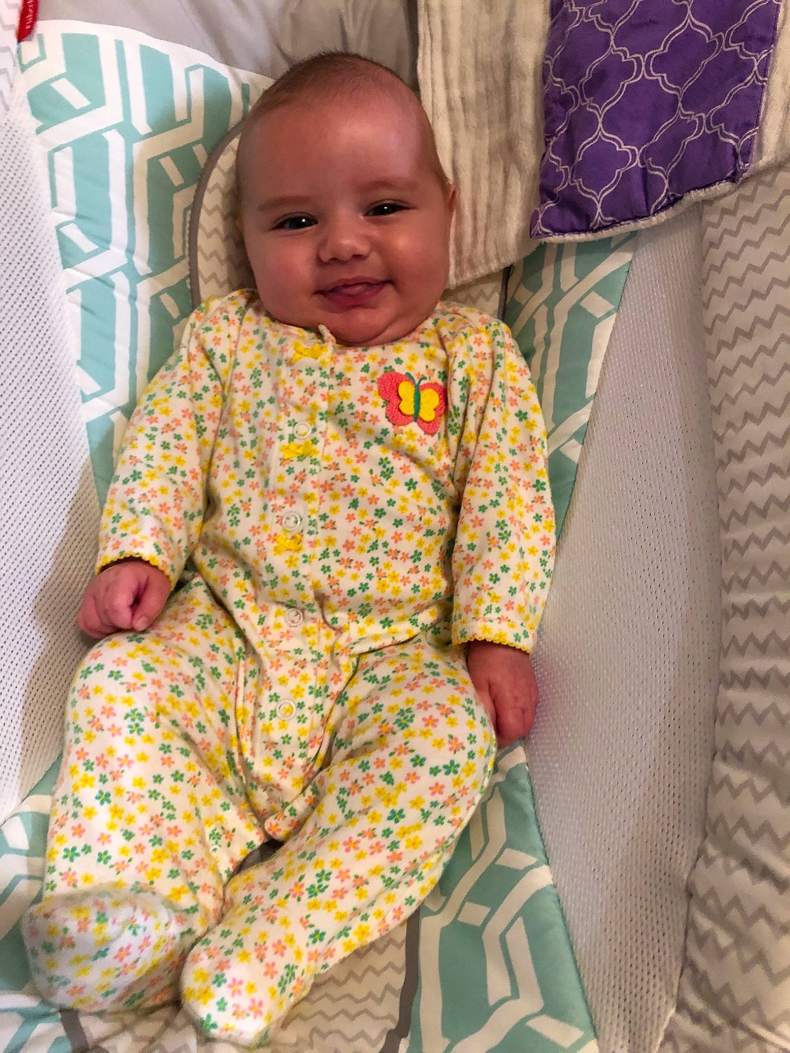 Jaelyn joined the competition — help win amazing prizes! baby, baby_toddler_clothing, child, pajamas, pattern, person, smile, textile, toddler, yellow