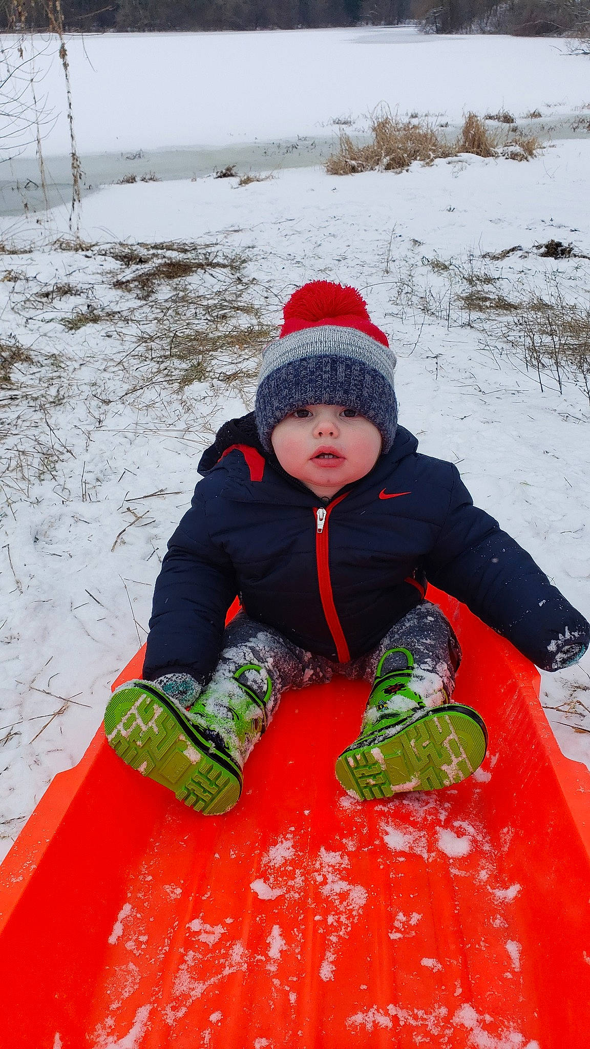 Jeffery is registered to the contest to win money with this photo: child, freezing, geological_phenomenon, person, play, playing_in_the_snow, recreation, snow, winter