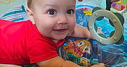 Baruk joined the competition — help win amazing prizes! activity_center, alphabet_blocks, baby, baby_toys, blue_eyes, brown_hair, child, closeup, colorful, happy, home, indoor, infant, play_mat, playtime, portrait, red_shirt, sitting, smiling, toy_ring