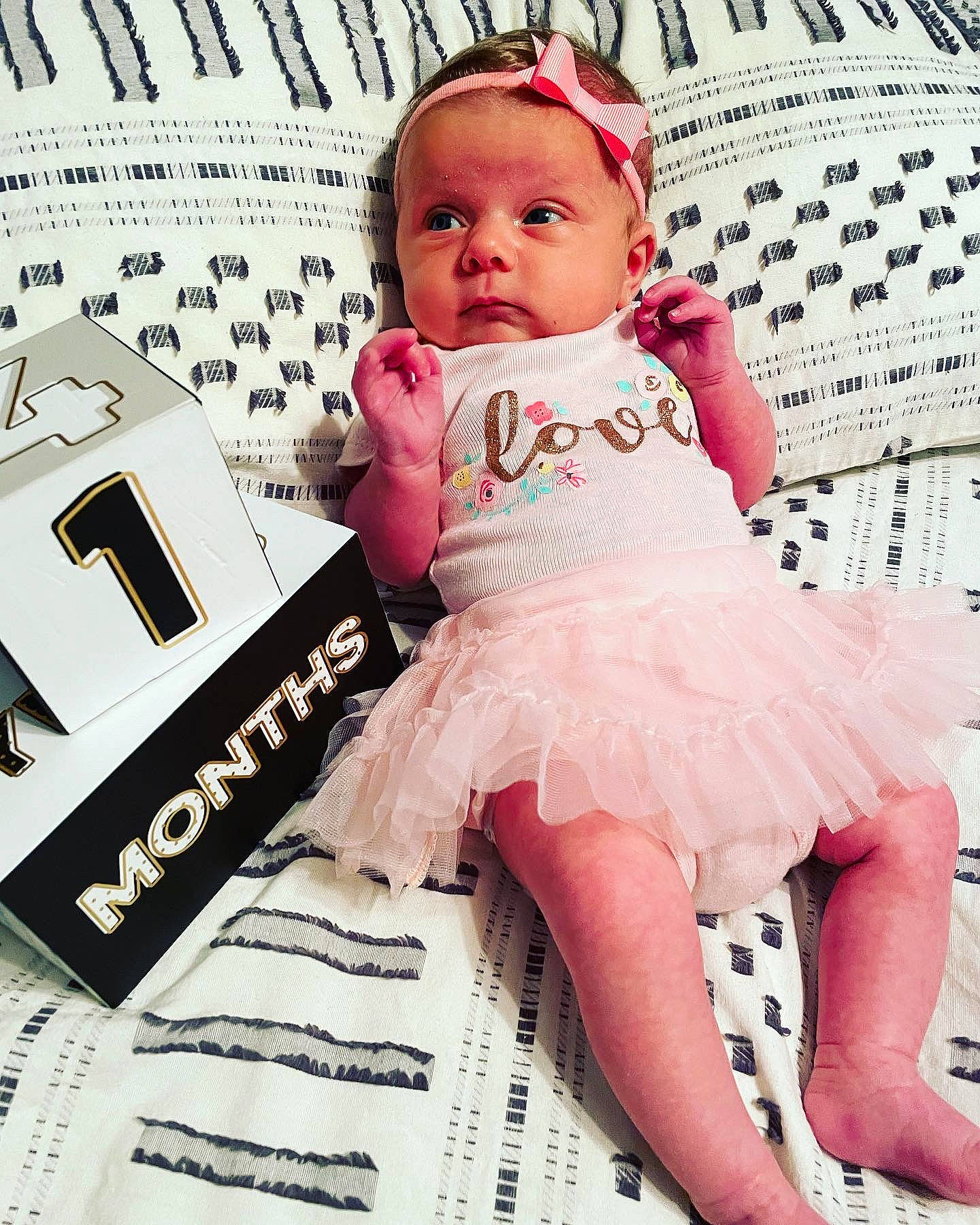 Brooks is registered to the contest to win money with this photo: baby, baby_toddler_clothing, beauty, comfort, cool, electronic_device, eye, eyelash, face, fashion, finger, font, happy, person, pink, skin, sleeve, textile, thigh, toddler