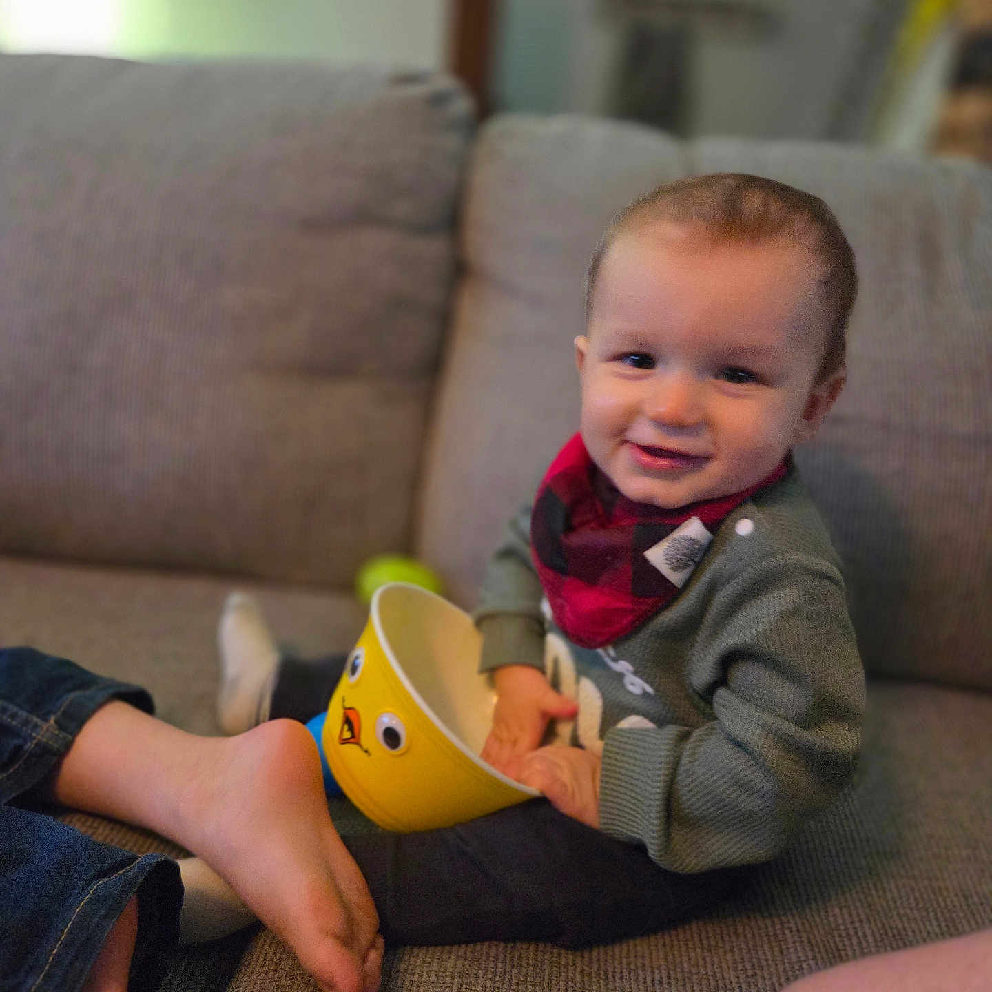 Easton joined the competition — help win amazing prizes! architecture, baby, bodypart, building, clothing, couch, cup, face, finger, furniture, hand, head, indoors, livingroom, pants, person, photography, portrait, room, sitting