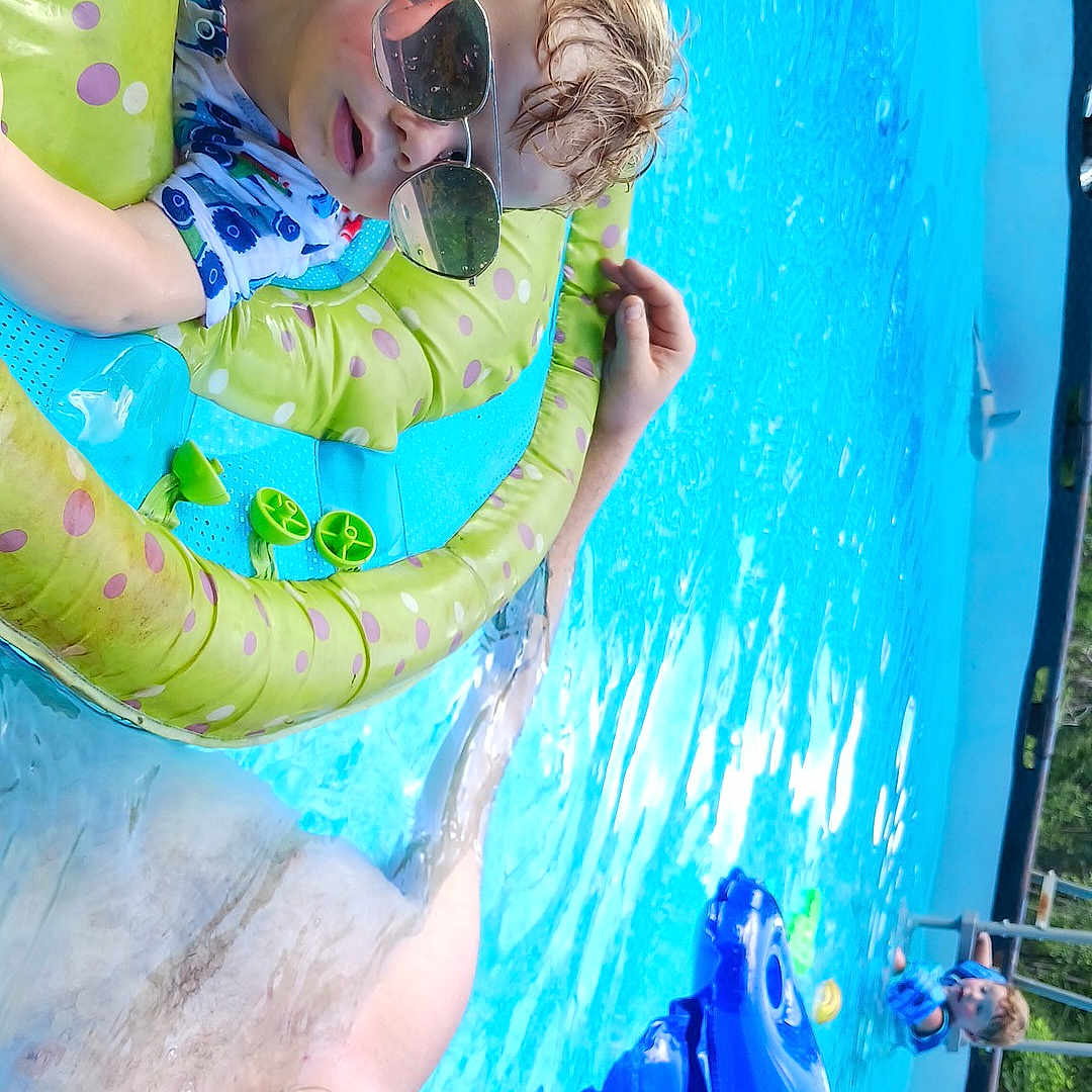 Liam is registered to the contest to win money with this photo: accessories, adult, amusementpark, baby, face, glasses, head, leisureactivities, person, photography, pool, portrait, sport, summer, sunglasses, swimming, swimmingpool, water, waterpark, watersports