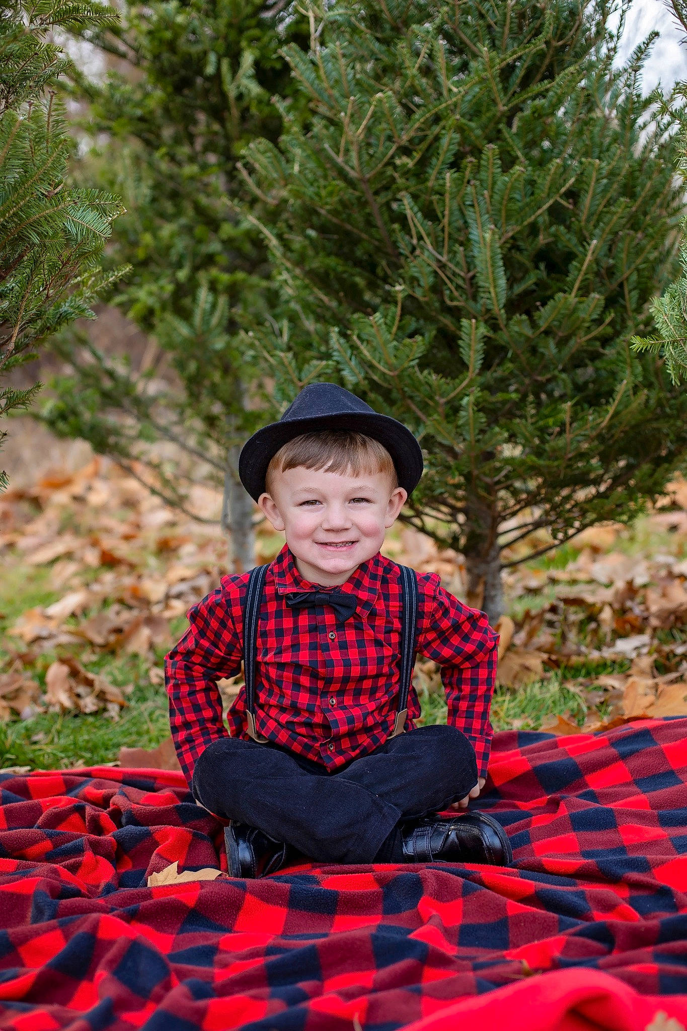 Weston joined the competition — help win amazing prizes! child, child_model, design, grass, headgear, joy, pattern, person, plaid, plant, red, sitting, tartan, textile, toddler, tree