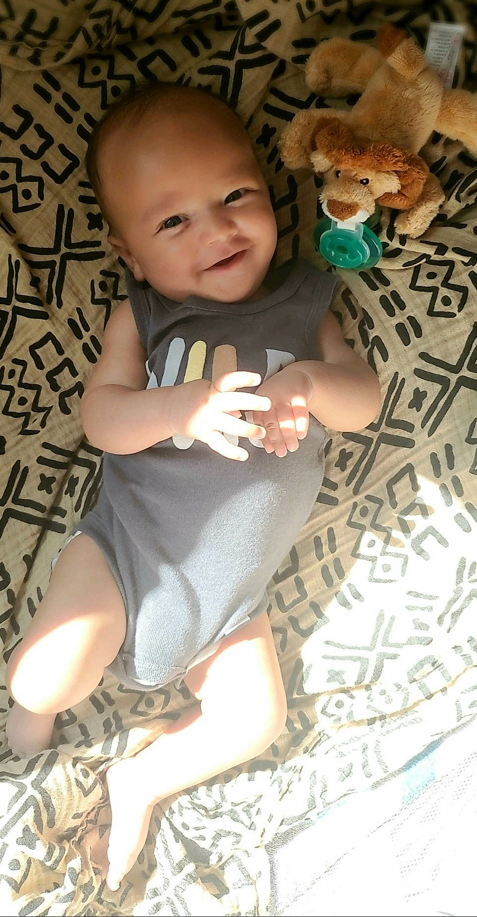 Dakari joined the competition — help win amazing prizes! baby, baby_toddler_clothing, cheek, eye, face, flooring, happy, head, human, iris, joy, leg, nail, pattern, person, skin, sleeve, smile, textile, thigh