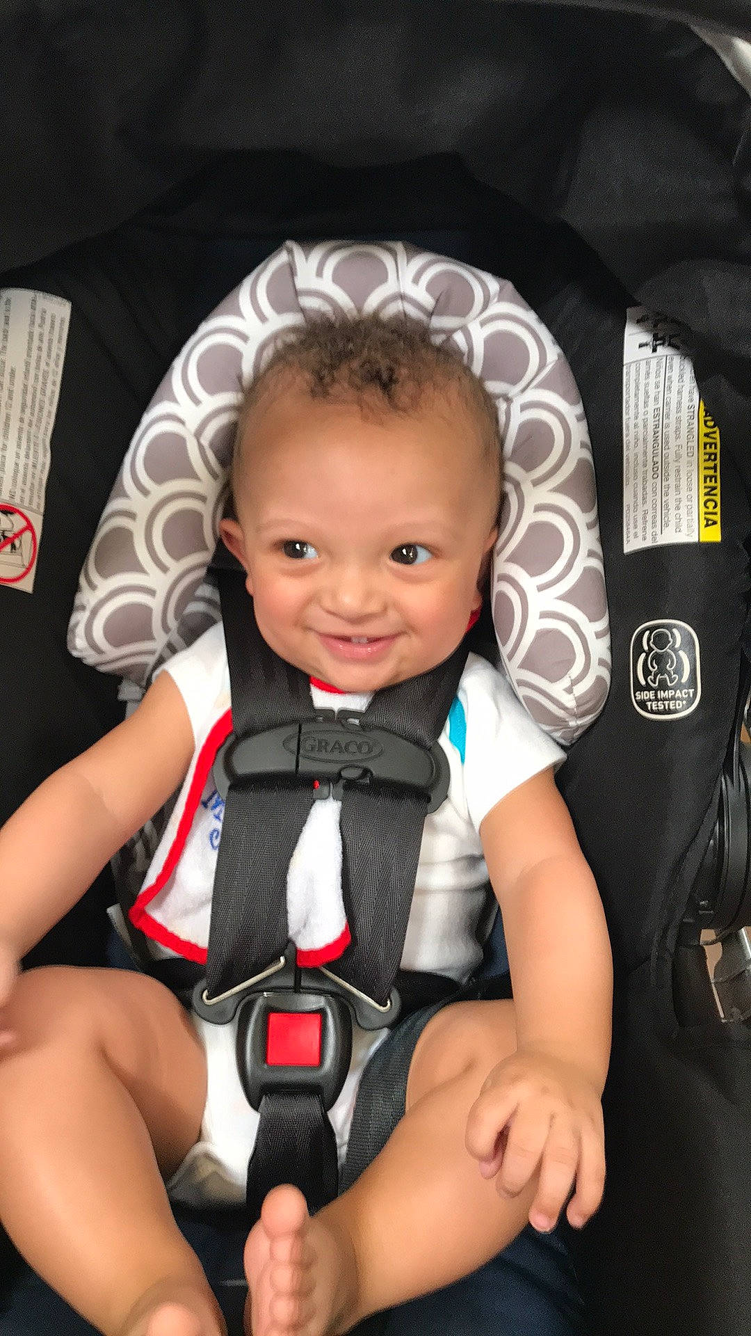 Kristopher is registered to the contest to win money with this photo: auto_part, baby, baby_carriage, baby_toddler_clothing, blond, cheek, child, comfort, eye, finger, flash_photography, fun, hand, happy, joy, knee, leg, person, seat_belt, smile