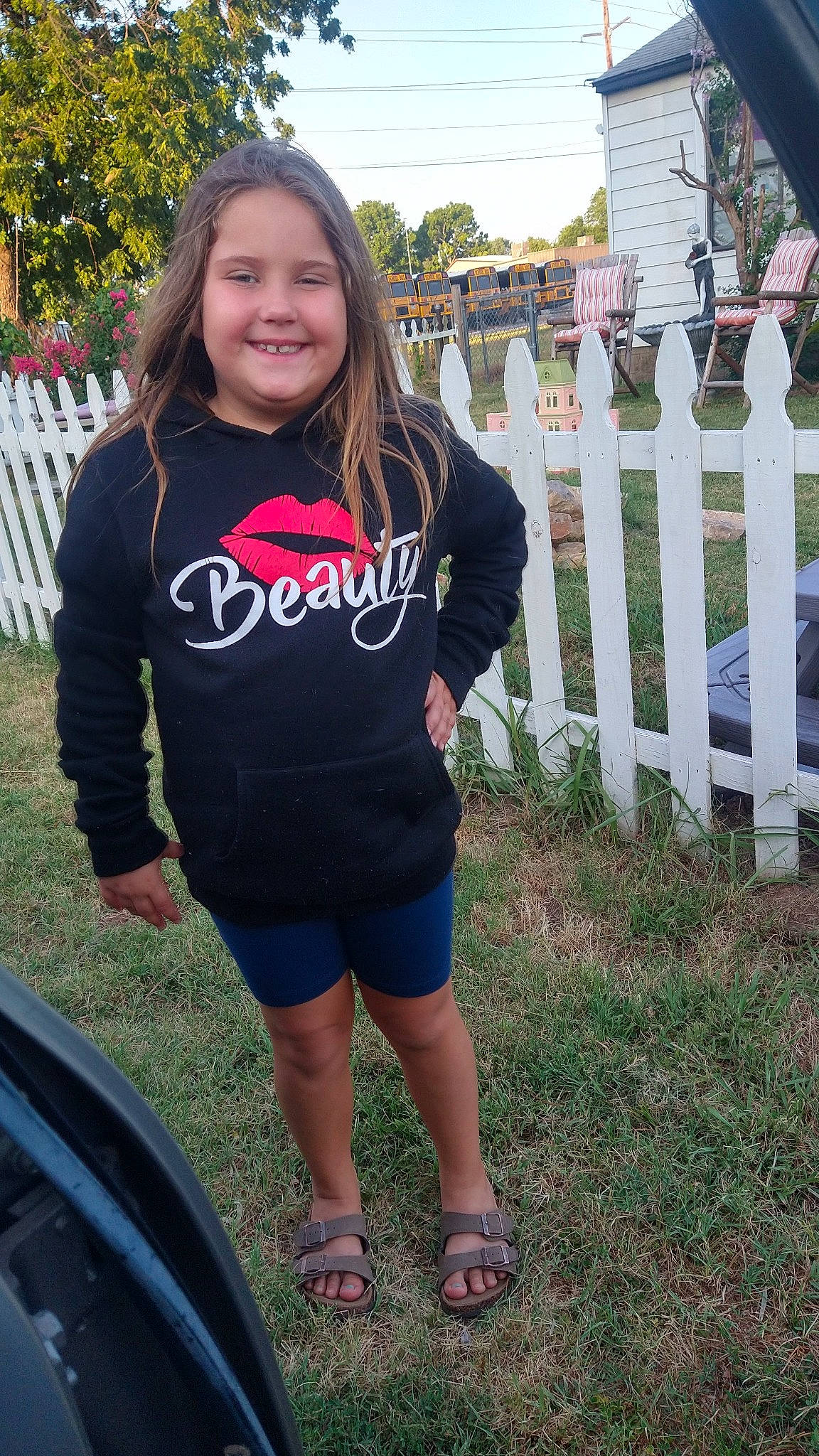 Lilly joined the competition — help win amazing prizes! electric_blue, fence, grass, happy, human_leg, joy, leg, leisure, long_hair, person, plant, recreation, shorts, shoulder, sleeve, smile, sportswear, t_shirt, thigh, tree