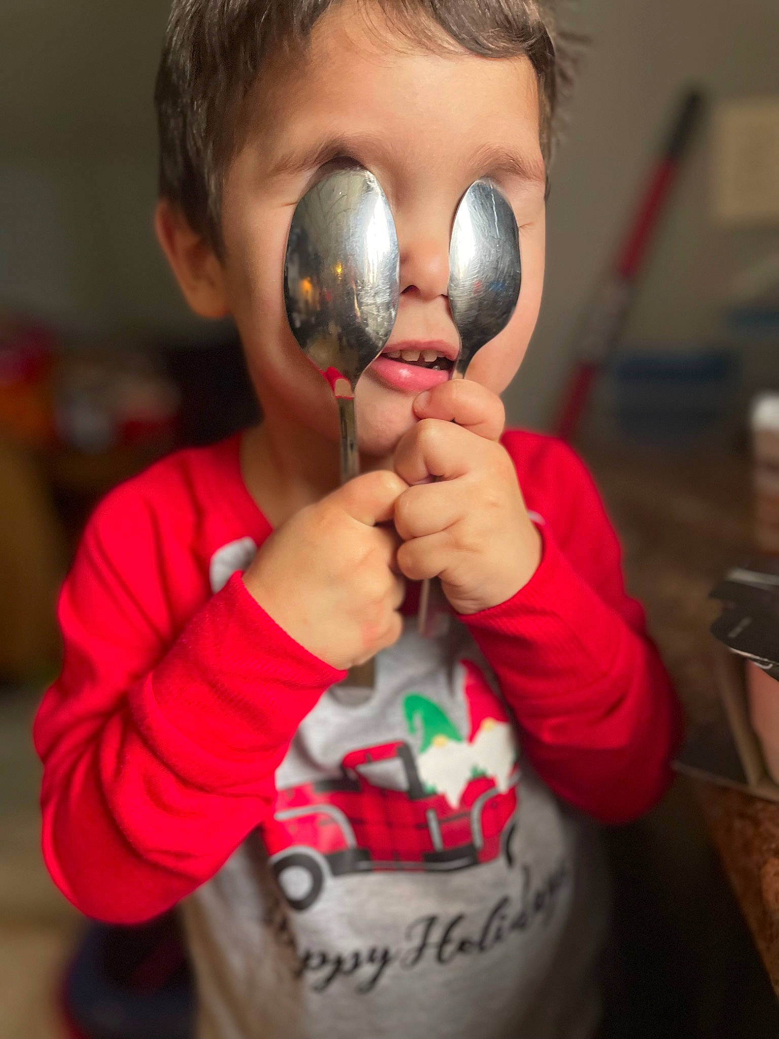 Dominic is registered to the contest to win money with this photo: audio_equipment, child, clothing, curious, eyelash, eyewear, finger, fun, gadget, gesture, goggles, happy, hearing, nose, person, personal_protective_equipment, pink, sleeve, toddler, tree