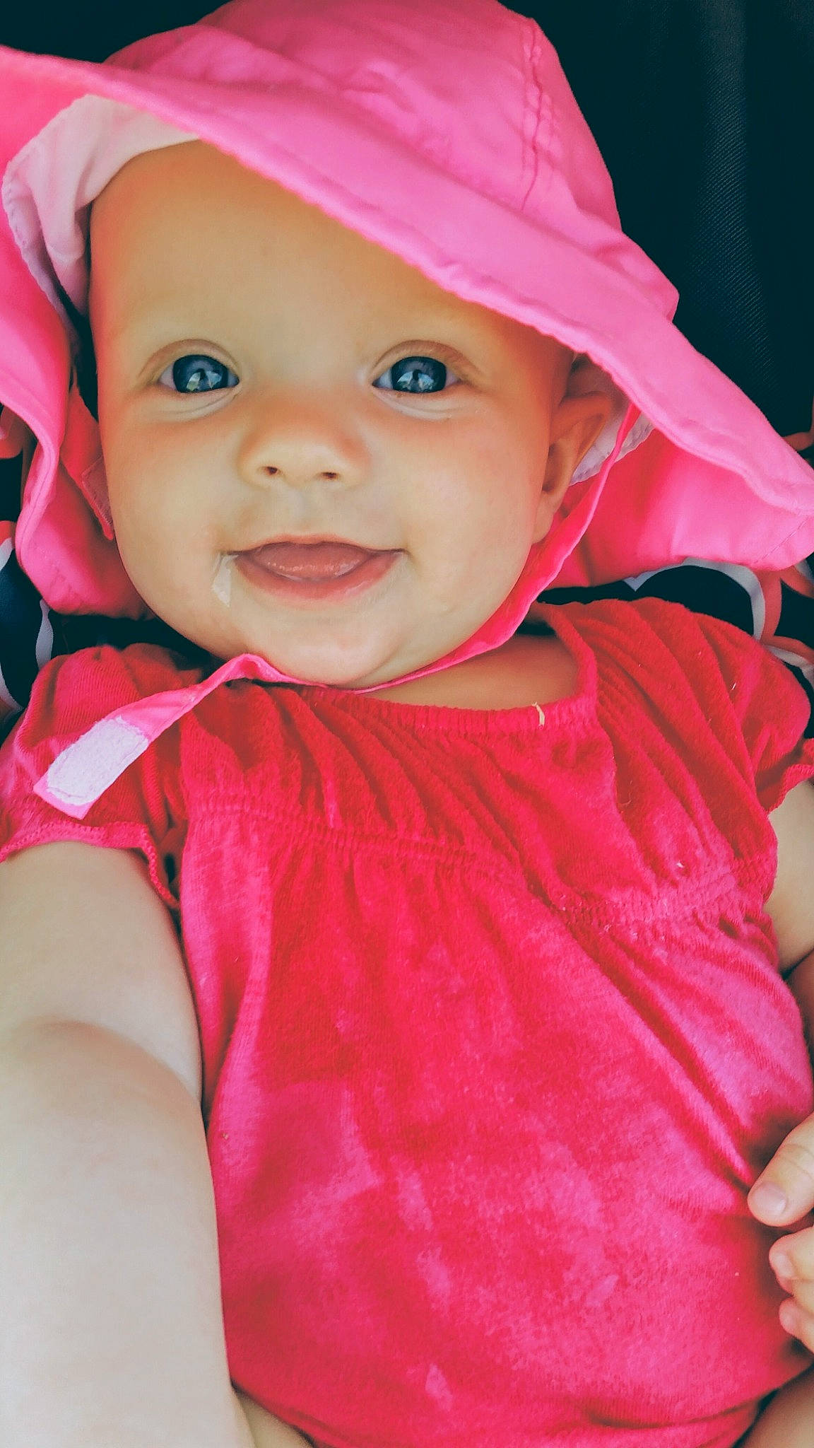 Charlee joined the competition — help win amazing prizes! baby, baby_toddler_clothing, cap, eye, face, facial_expression, happy, head, headgear, headwear, iris, lip, magenta, outerwear, person, pink, purple, red, skin, sleeve