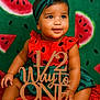 baby, child, watermelon, birthday, sign, red_clothing, headband, green_background, cute, sitting, smiling, portrait, celebration, fruit, skin, hand, foot, decor, photography, happy
