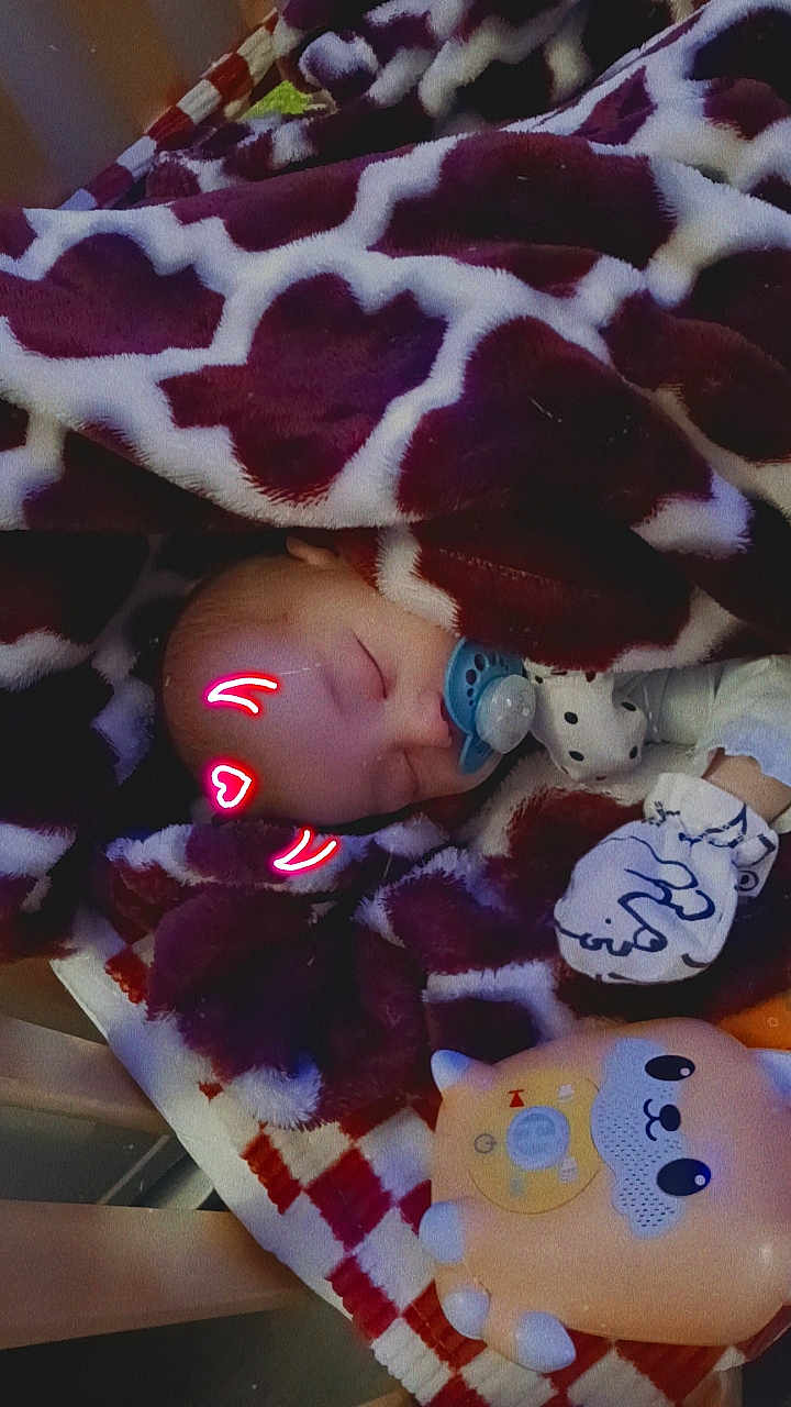 Silas joined the competition — help win amazing prizes! baby, bed, blanket, bodypart, couch, cushion, face, finger, furniture, hand, head, homedecor, newborn, person, photography, portrait, purple, quilt, sleeping, toy