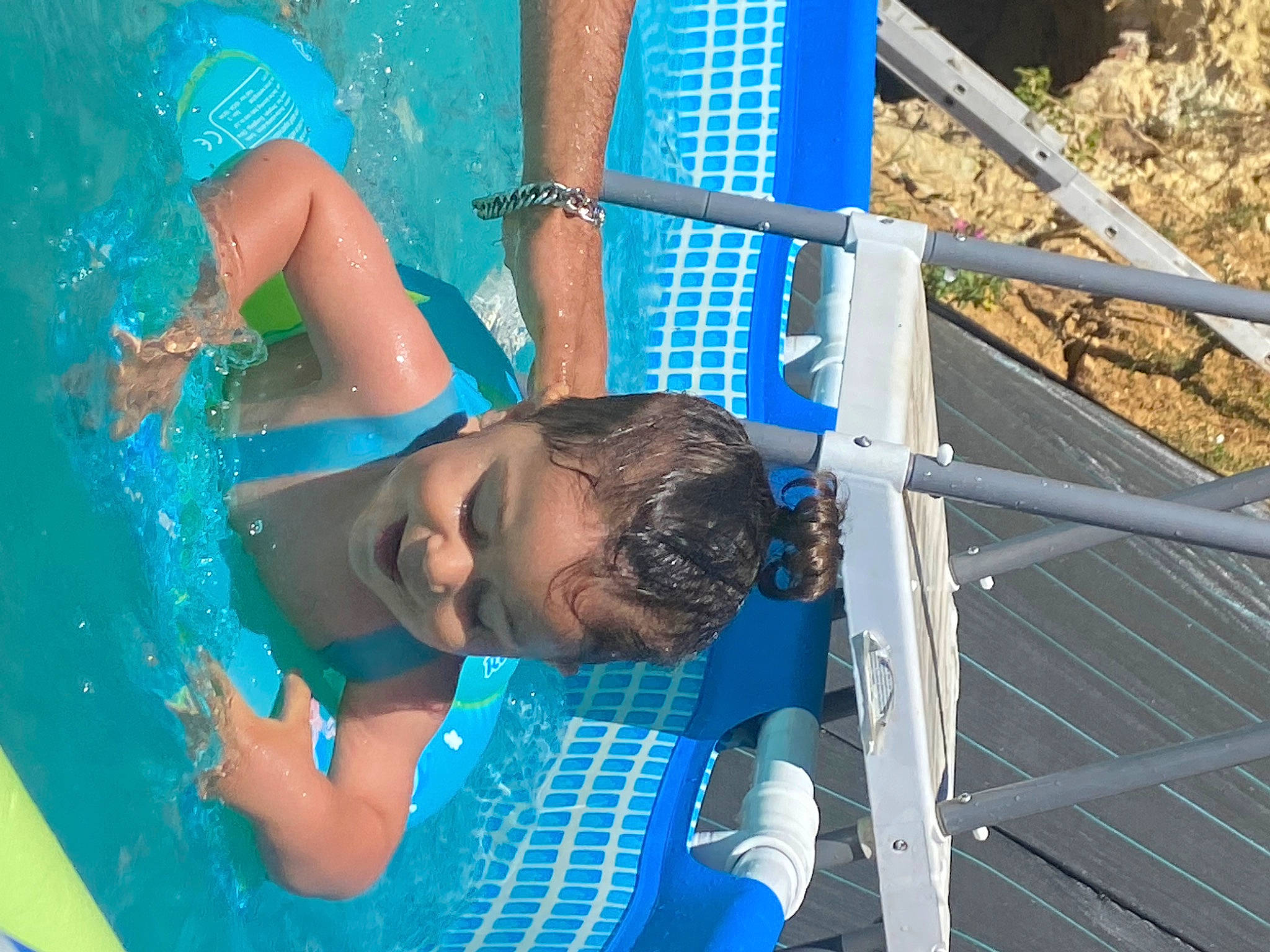 Ziad participe au concours pour gagner de l'argent avec cette photo : azure, blue, child, elbow, electric_blue, fun, happy, leisure, nonbuilding_structure, person, recreation, rope, sky, swimming_pool, vacation, water