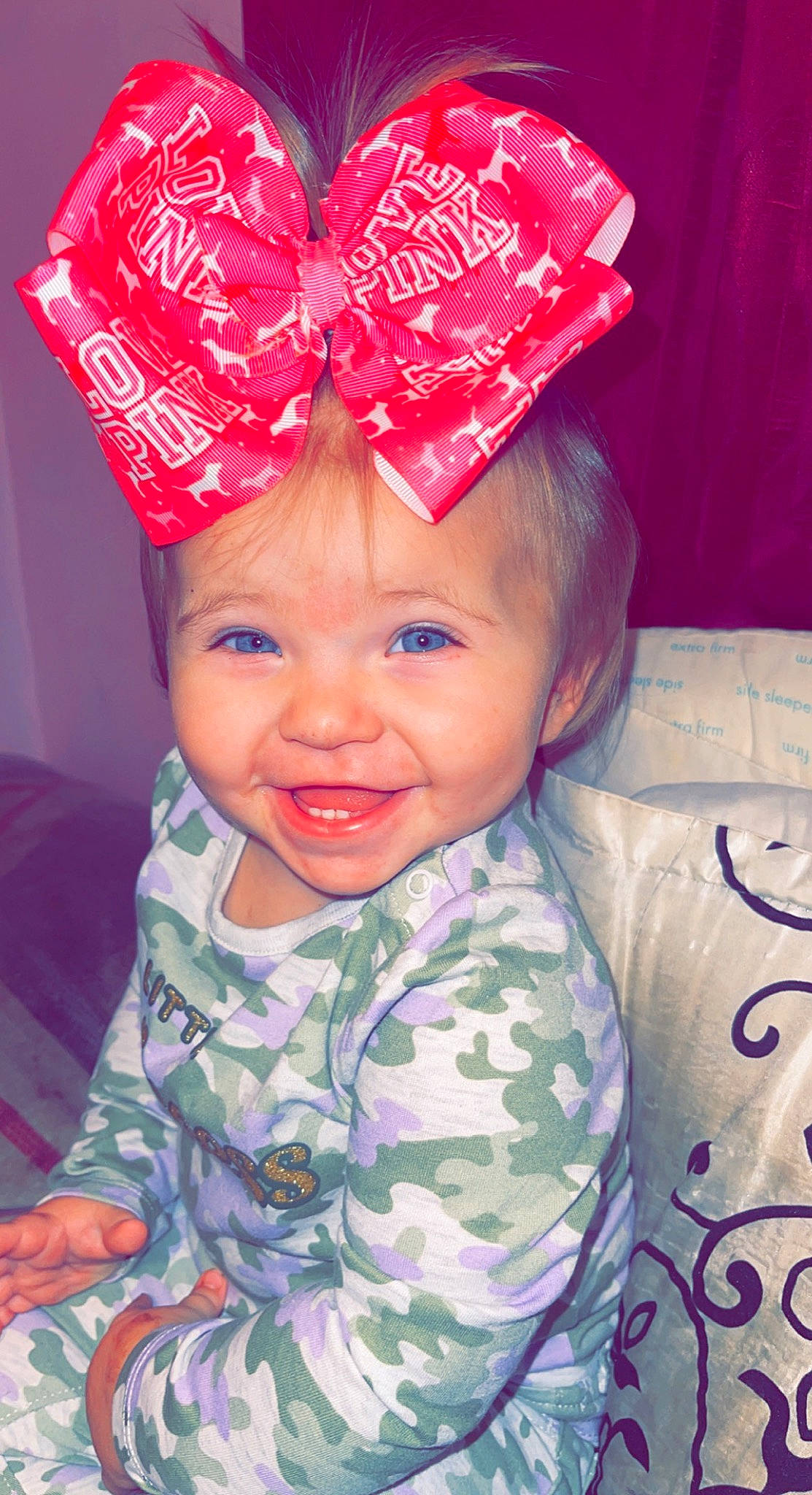 Natalie is registered to the contest to win money with this photo: baby_toddler_clothing, cap, costume_hat, eye, eyebrow, face, fun, happy, head, headgear, headwear, joy, lip, mouth, nose, outerwear, person, pink, skin, sleeve