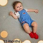 Kingston joined the competition — help win amazing prizes! baby, infant, child, smiling, portrait, lying_down, rug, blue_overalls, red_socks, casual_clothing, brown_hair, bright_lighting, bokeh, milestone, eleven_months, indoor, home, happy, photography, text_overlay