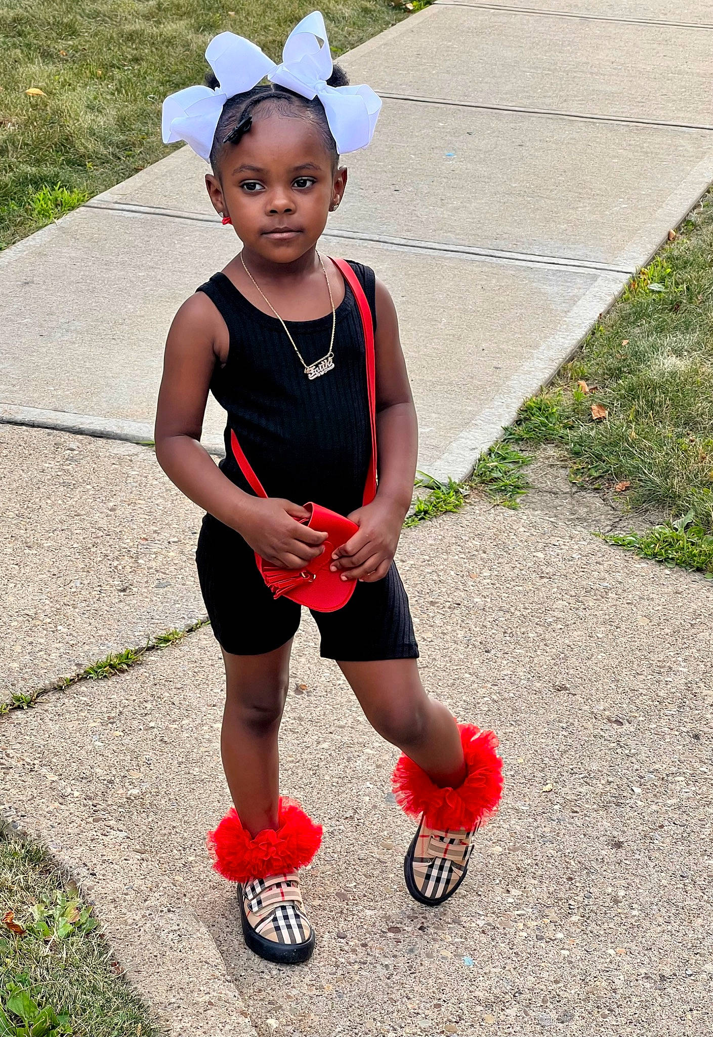 Faith is registered to the contest to win money with this photo: baby_toddler_clothing, ball, costume_hat, dress, eye, face, facial_expression, grass, hair, happy, knee, mammal, person, recreation, shorts, smile, sports_equipment, thigh, tire, toddler