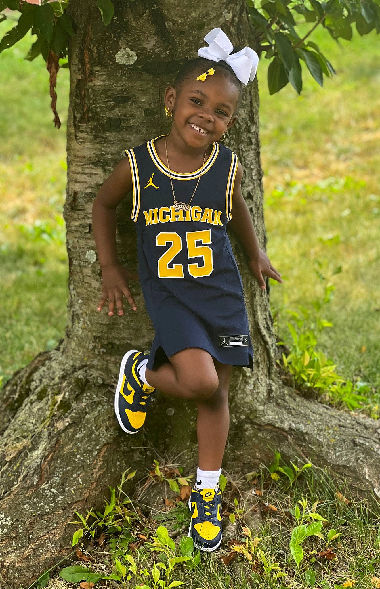 Faith joined the competition — help win amazing prizes! face, footwear, grass, happy, jersey, joy, leisure, people_in_nature, person, plant, recreation, shoe, shorts, sleeveless_shirt, smile, sneakers, sports, sportswear, t_shirt, thigh