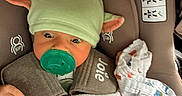 Weston joined the competition — help win amazing prizes! baby, child, car_seat, pacifier, hat, blanket, infant, cute, wrapped, cozy, clothing, seatbelt, indoor, newborn, person, headwear, comfort, small, adorable, resting