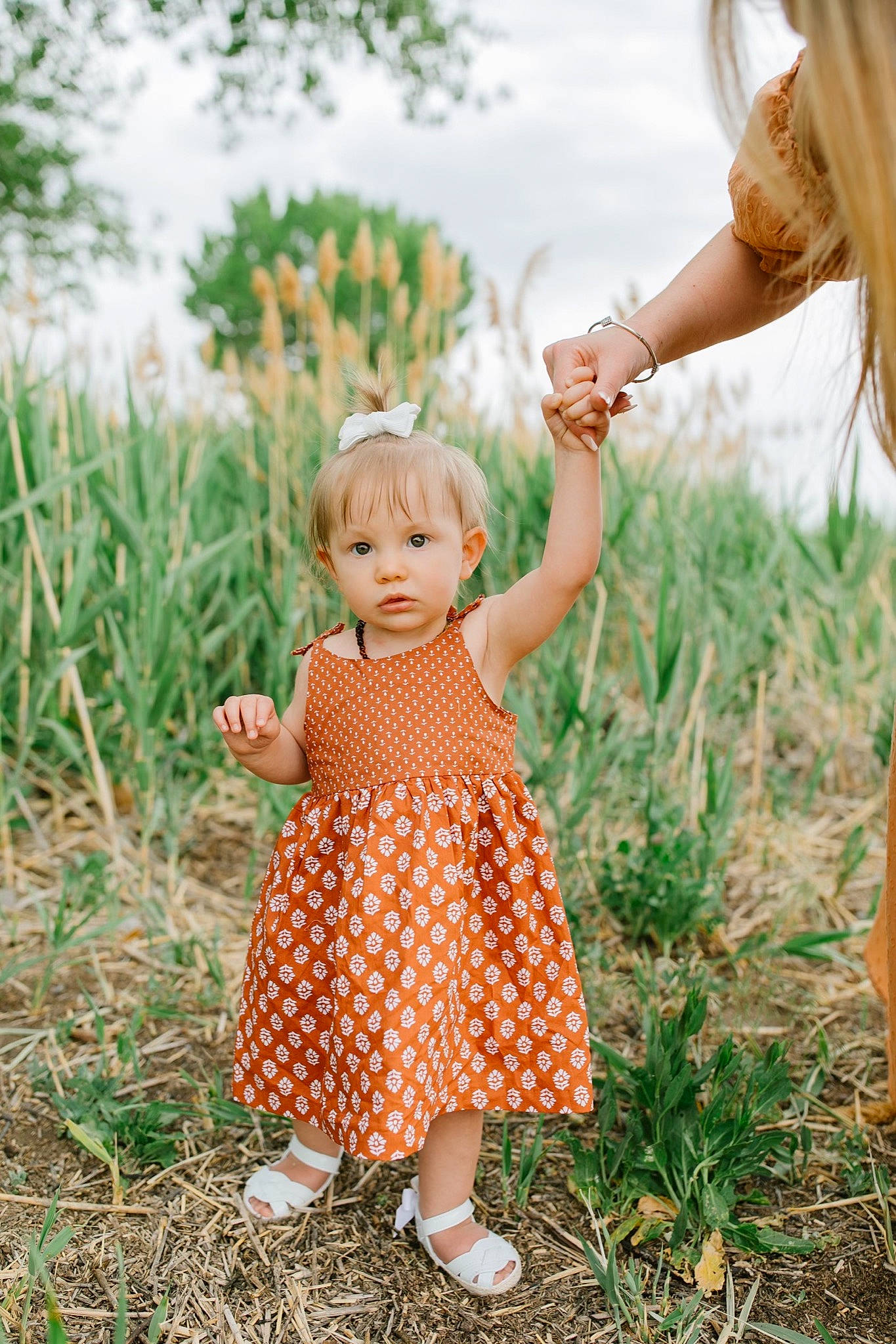 Sayla joined the competition — help win amazing prizes! arm, baby_toddler_clothing, beauty, child, gesture, grass, grass_family, grassland, hand, happy, meadow, people_in_nature, person, plant, playing_with_kids, skin, sky, summer, sunlight, toddler