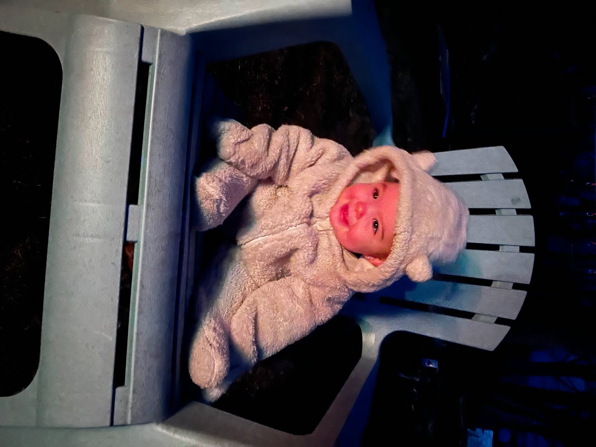 Mary is registered to the contest to win money with this photo: baby, baby_products, baby_toddler_clothing, child, comfort, headwear, linens, person, room, sitting, toddler, tree, vehicle_door, wood