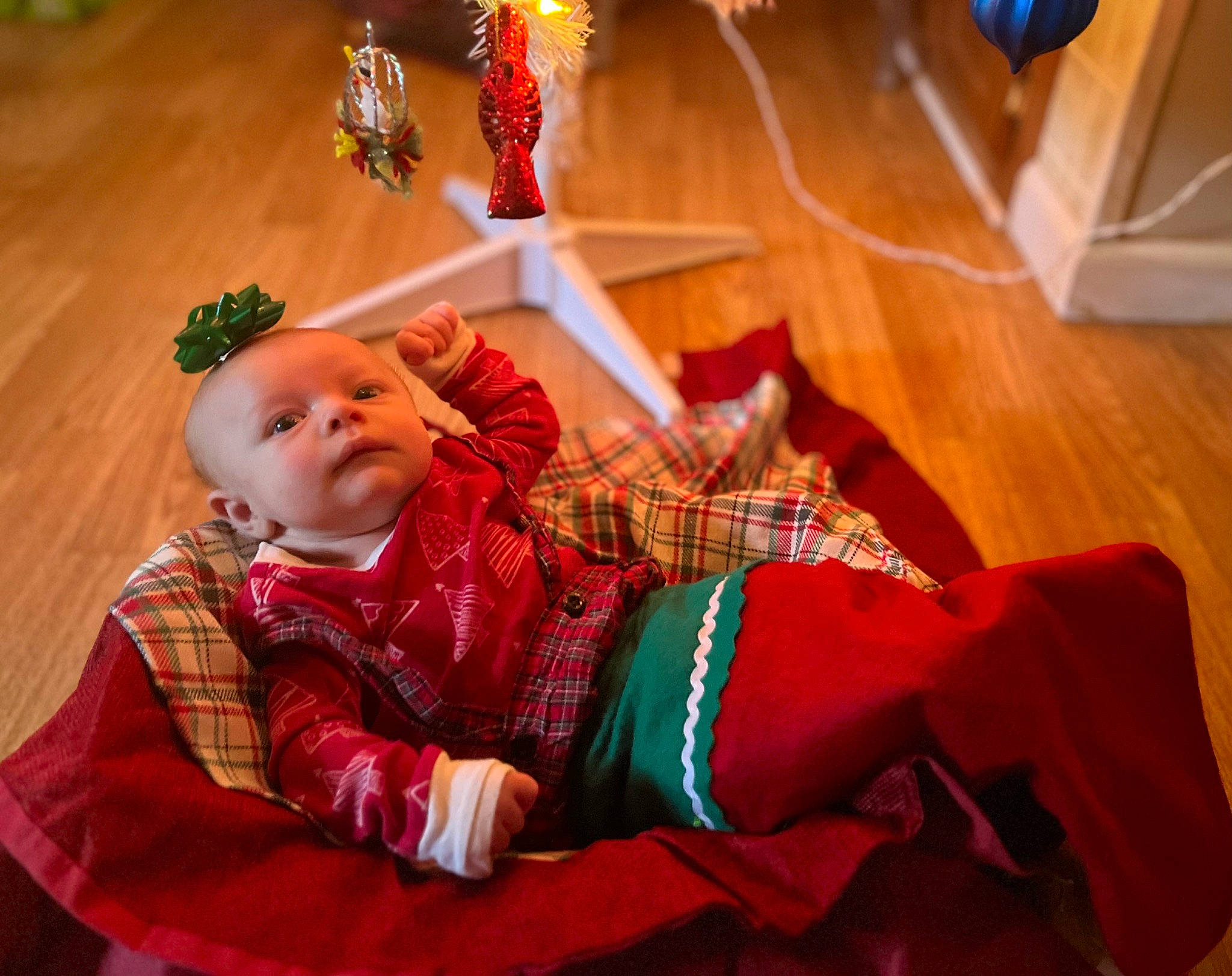 Joshuaa joined the competition — help win amazing prizes! baby, baby_toddler_clothing, carmine, child, christmas, comfort, event, flooring, fun, happy, hardwood, orange, pattern, person, plaid, room, sitting, tartan, toddler, tradition