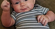 Cora is registered to the contest to win money with this photo: baby, child, smiling, couch, striped_shirt, floral_pants, indoor, window, daylight, face, hand, furniture, happy, portrait, infant, cute, skin, clothing, home, expression