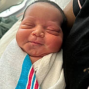Orion is registered to the contest to win money with this photo: newborn, baby, infant, sleeping, wrapped, blanket, hospital, closeup, face, soft, peaceful, resting, child, person, human, cute, skin, head, comfort, tender