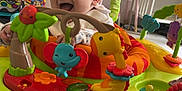 Archie joined the competition — help win amazing prizes! baby, child, infant, smiling, toys, activity_center, fisher_price, playful, indoor, nursery, stuffed_animals, furniture, floor, clothing, happy, legs, colorful, seat, baby_toys, fun