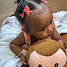 Capri joined the competition — help win amazing prizes! adorable, baby, blanket, bracelet, child, clothing, curly_hair, cute, earrings, indoors, monkey, person, pink_bows, plush_toy, portrait, sitting, soft_lighting, striped, toddler, toy