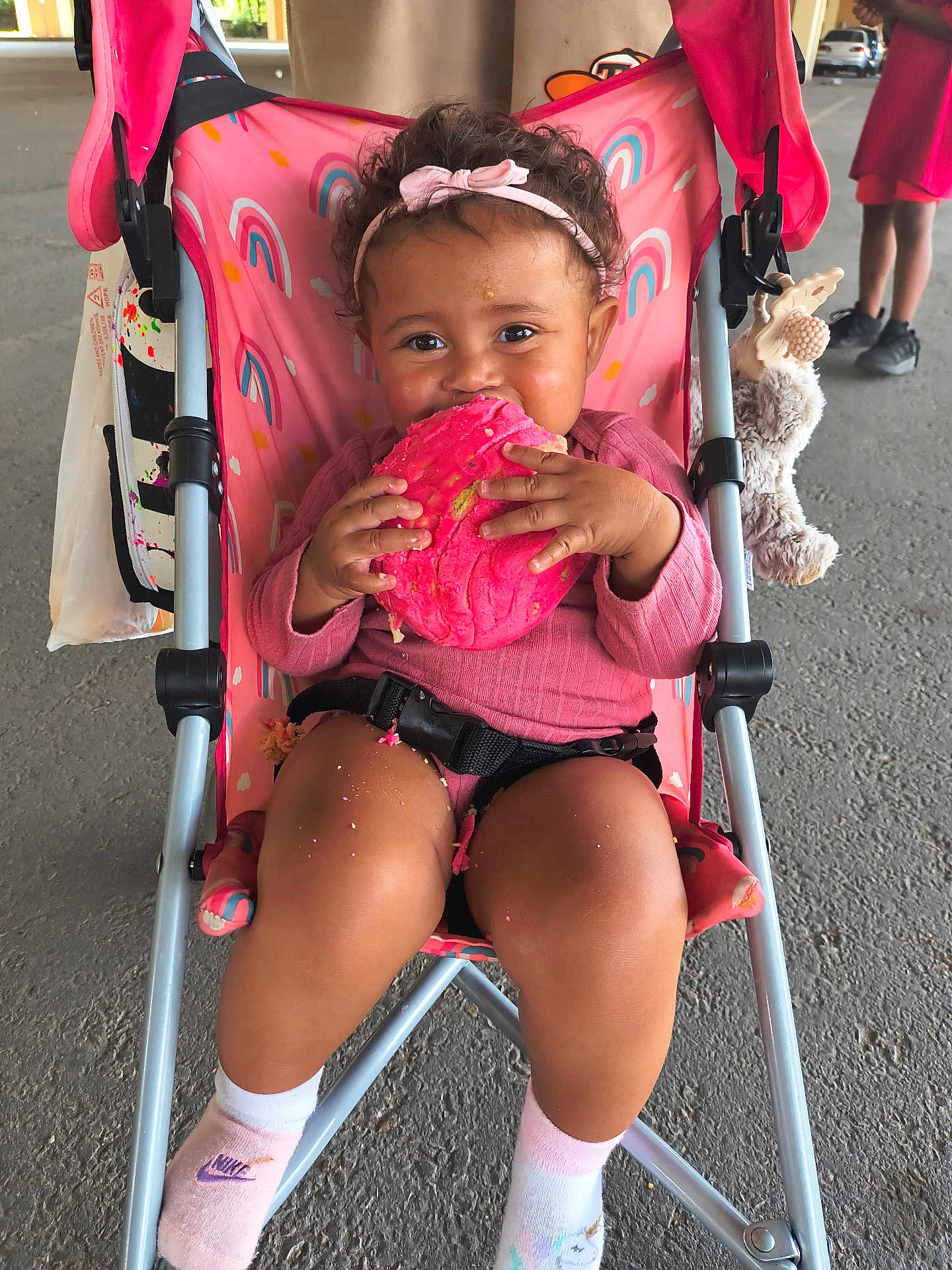 Dream joined the competition — help win amazing prizes! toddler, child, stroller, cookie, pink, headband, smiling, happy, snack, toy, plush, clothing, socks, shoes, outdoor, person, seatbelt, curly_hair, food, playful