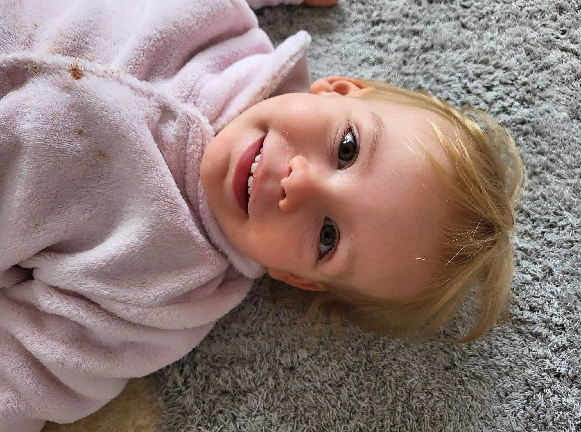 Briseis participe au concours pour gagner de l'argent avec cette photo : baby, baby_toddler_clothing, cheek, child, eyelash, flash_photography, flooring, fur, grass, happy, hat, joy, lip, nose, person, portrait, portrait_photography, sitting, sleeve, smile